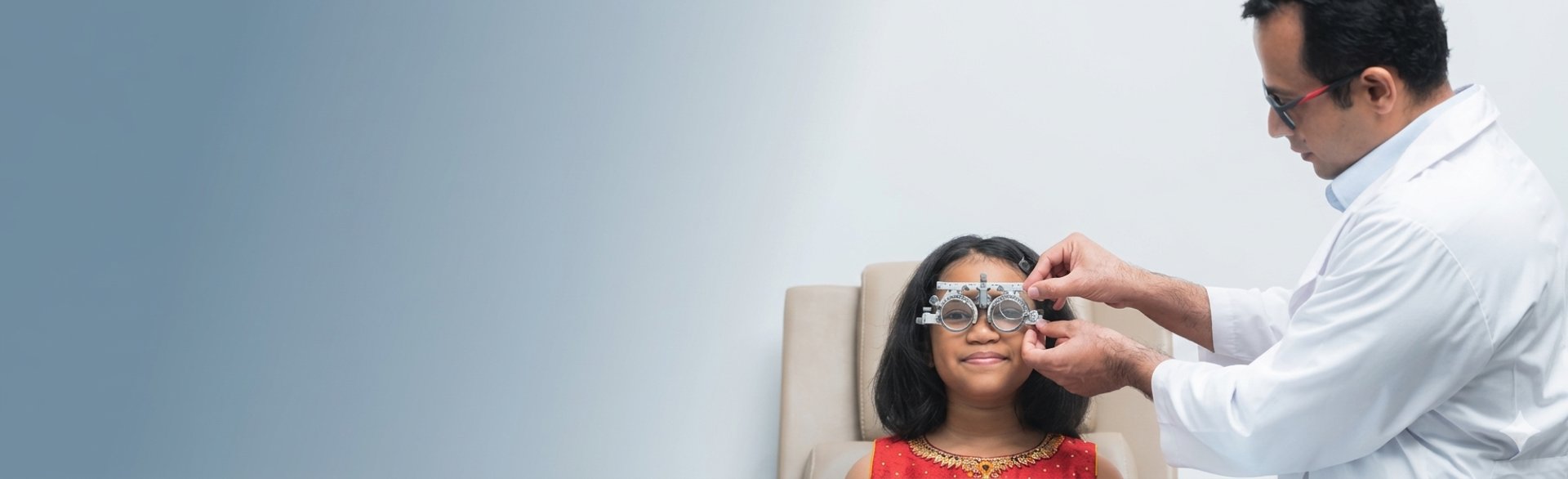 an abstract photo of a curved building with a blue sky in the background