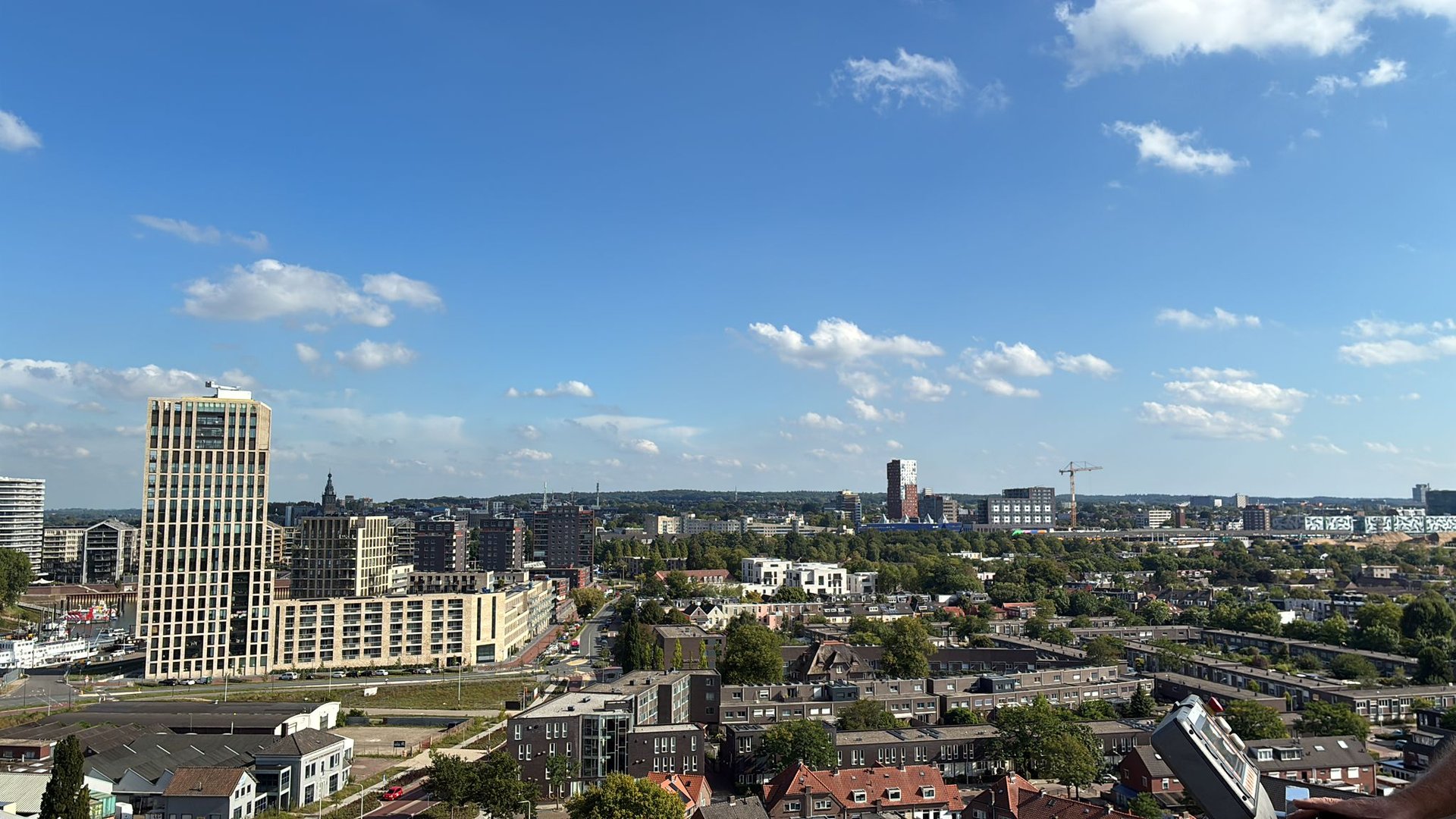 an abstract photo of a curved building with a blue sky in the background