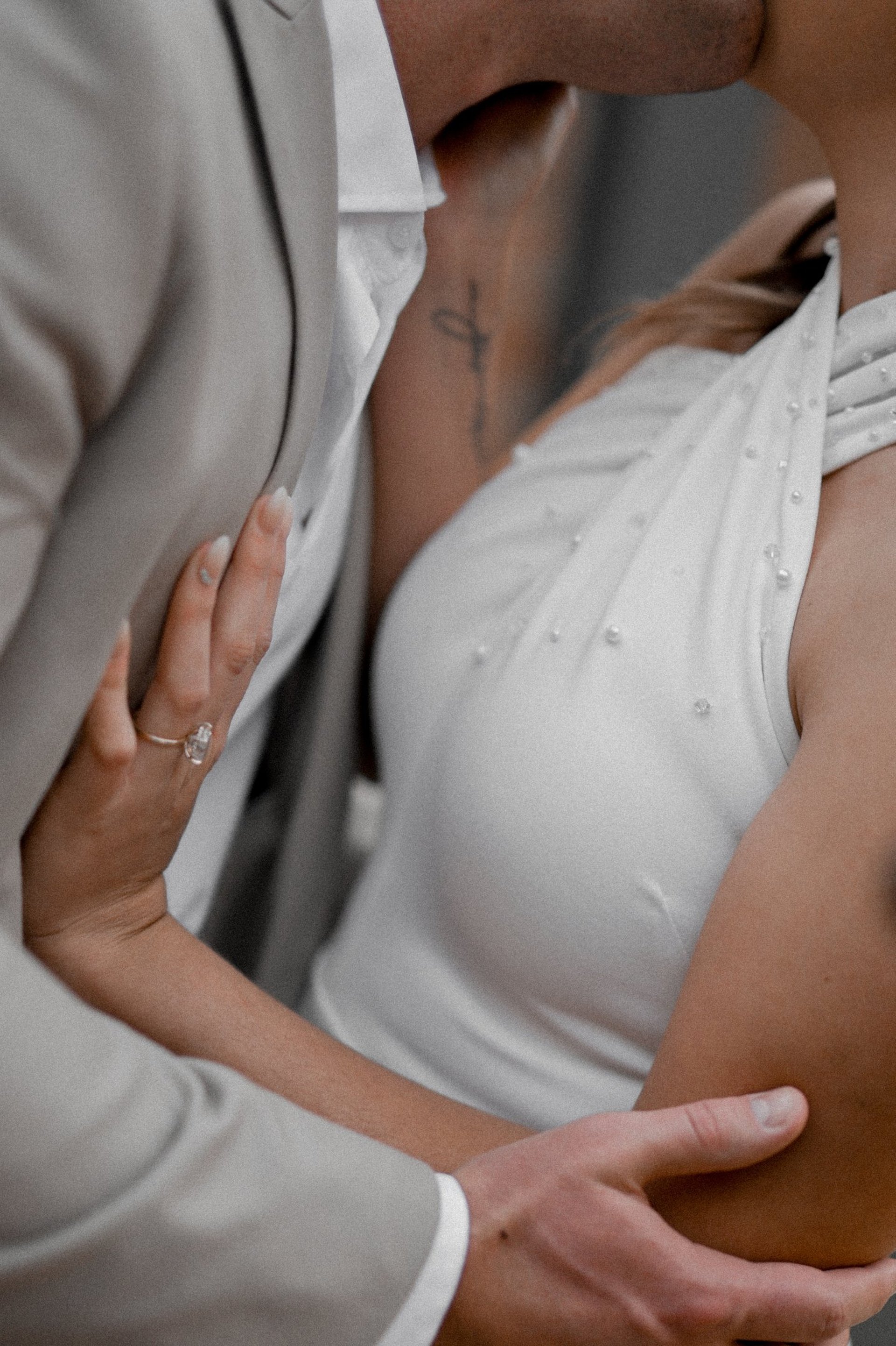 couple wearing silver-colored rings