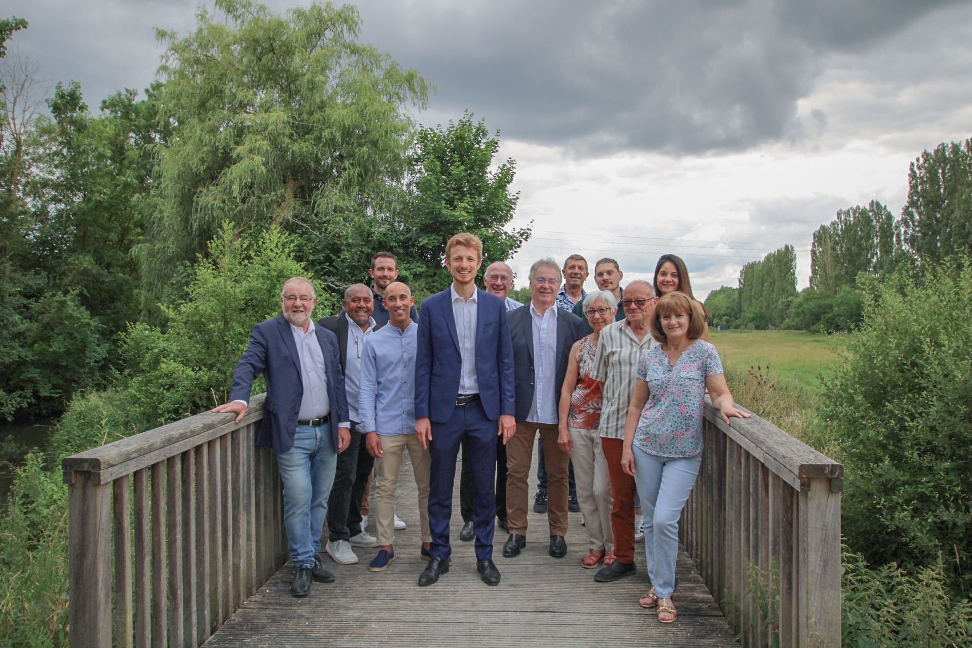woman wearing yellow long-sleeved dress under white clouds and blue sky during daytime