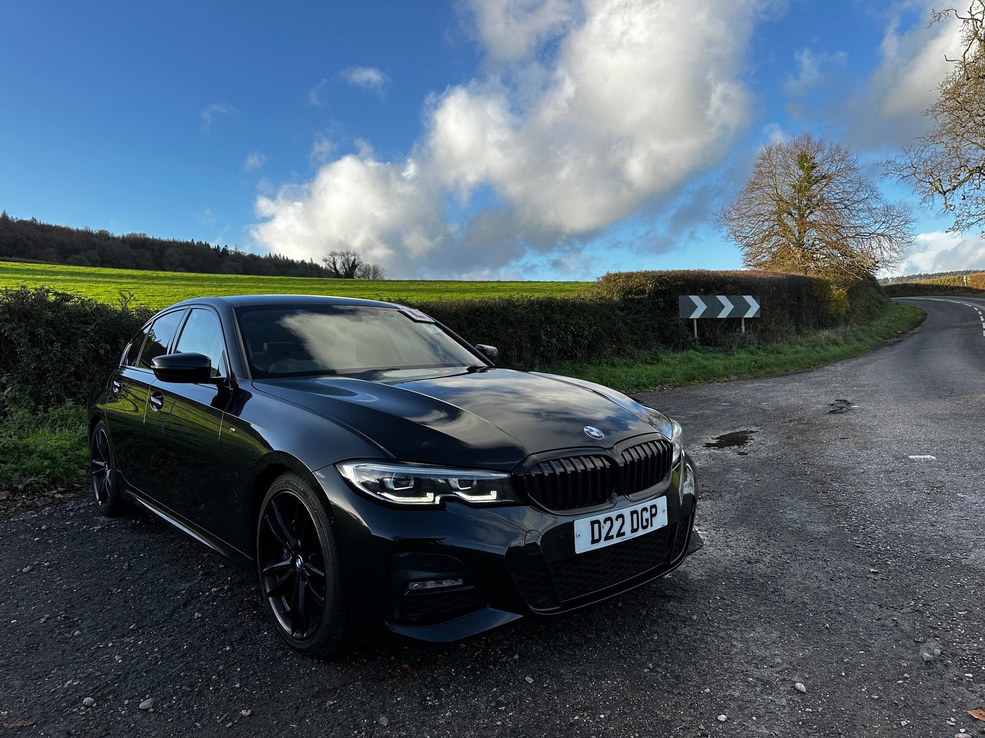 woman wearing yellow long-sleeved dress under white clouds and blue sky during daytime