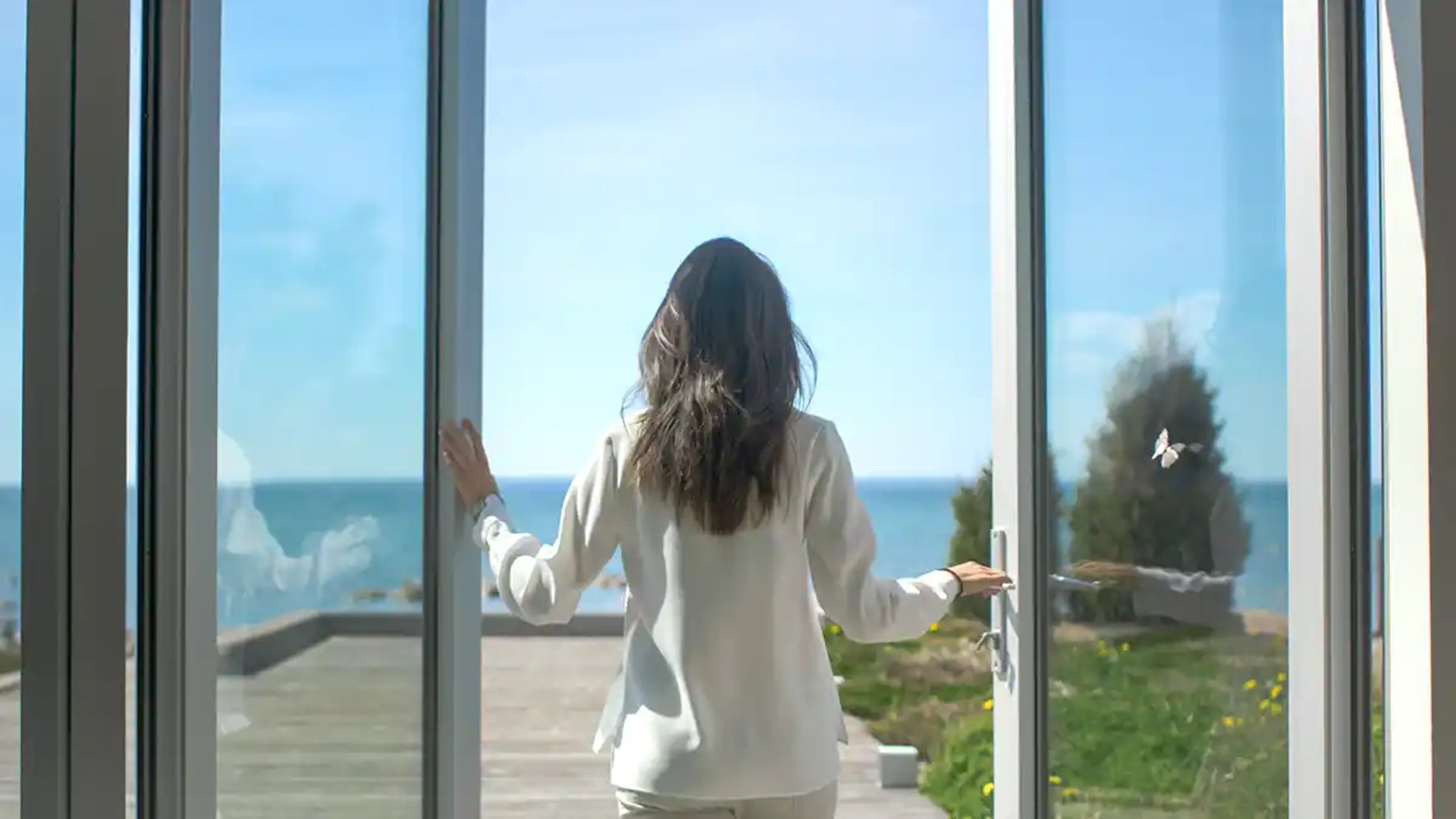 an abstract photo of a curved building with a blue sky in the background