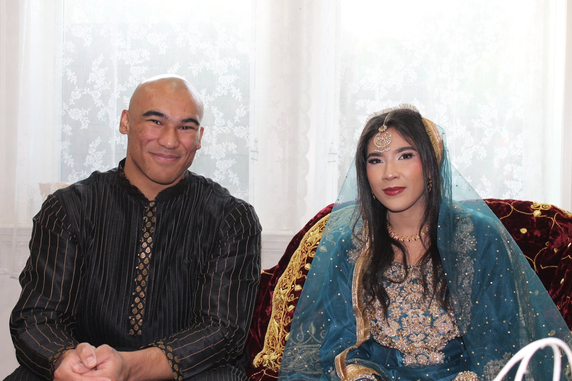 couple wearing silver-colored rings