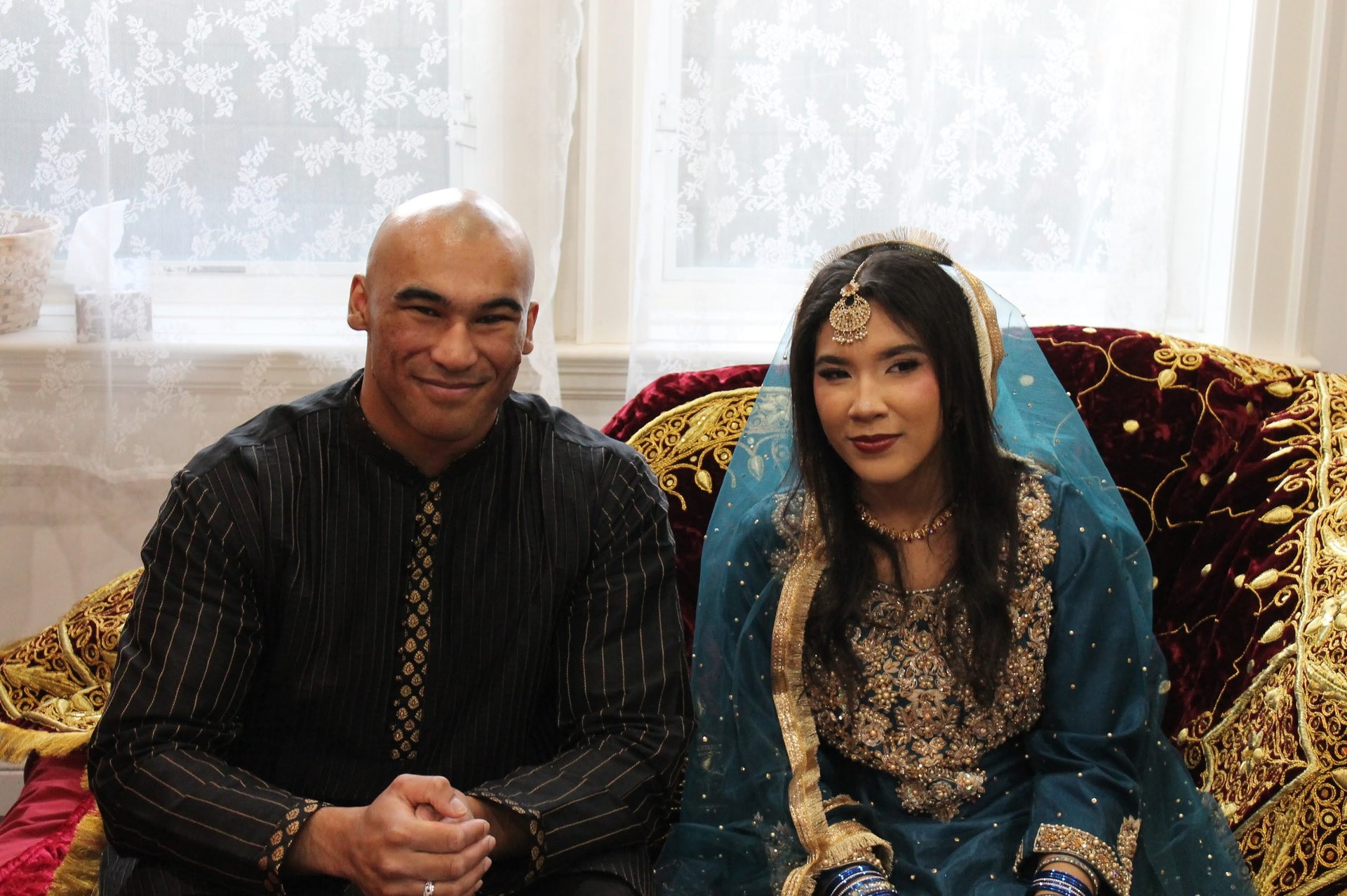 couple wearing silver-colored rings