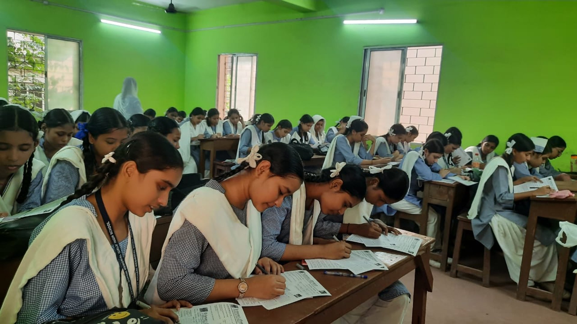 an abstract photo of a curved building with a blue sky in the background