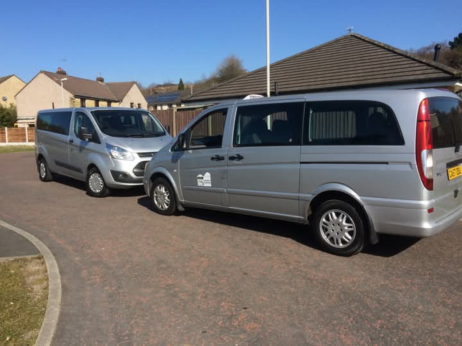 an abstract photo of a curved building with a blue sky in the background