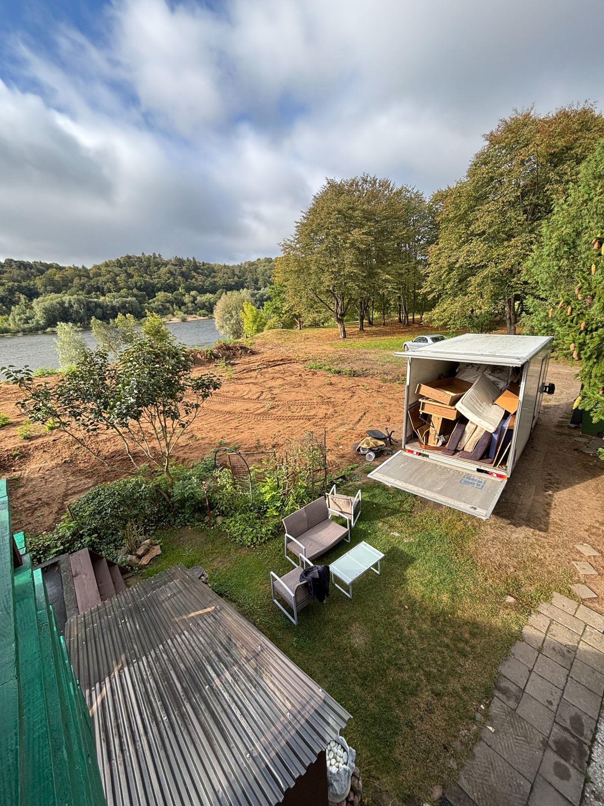 woman wearing yellow long-sleeved dress under white clouds and blue sky during daytime