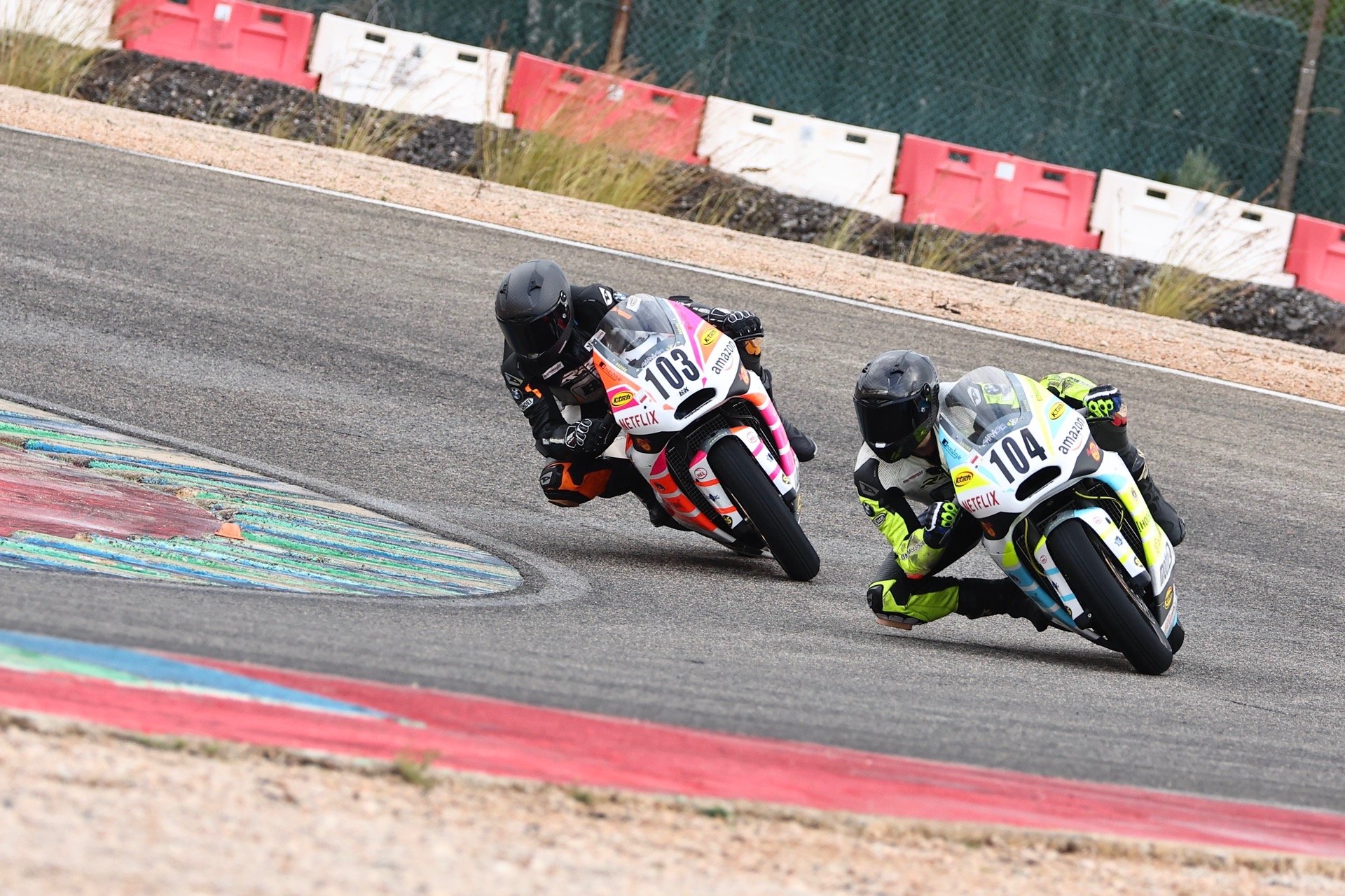 a person riding a motorcycle on a race track
