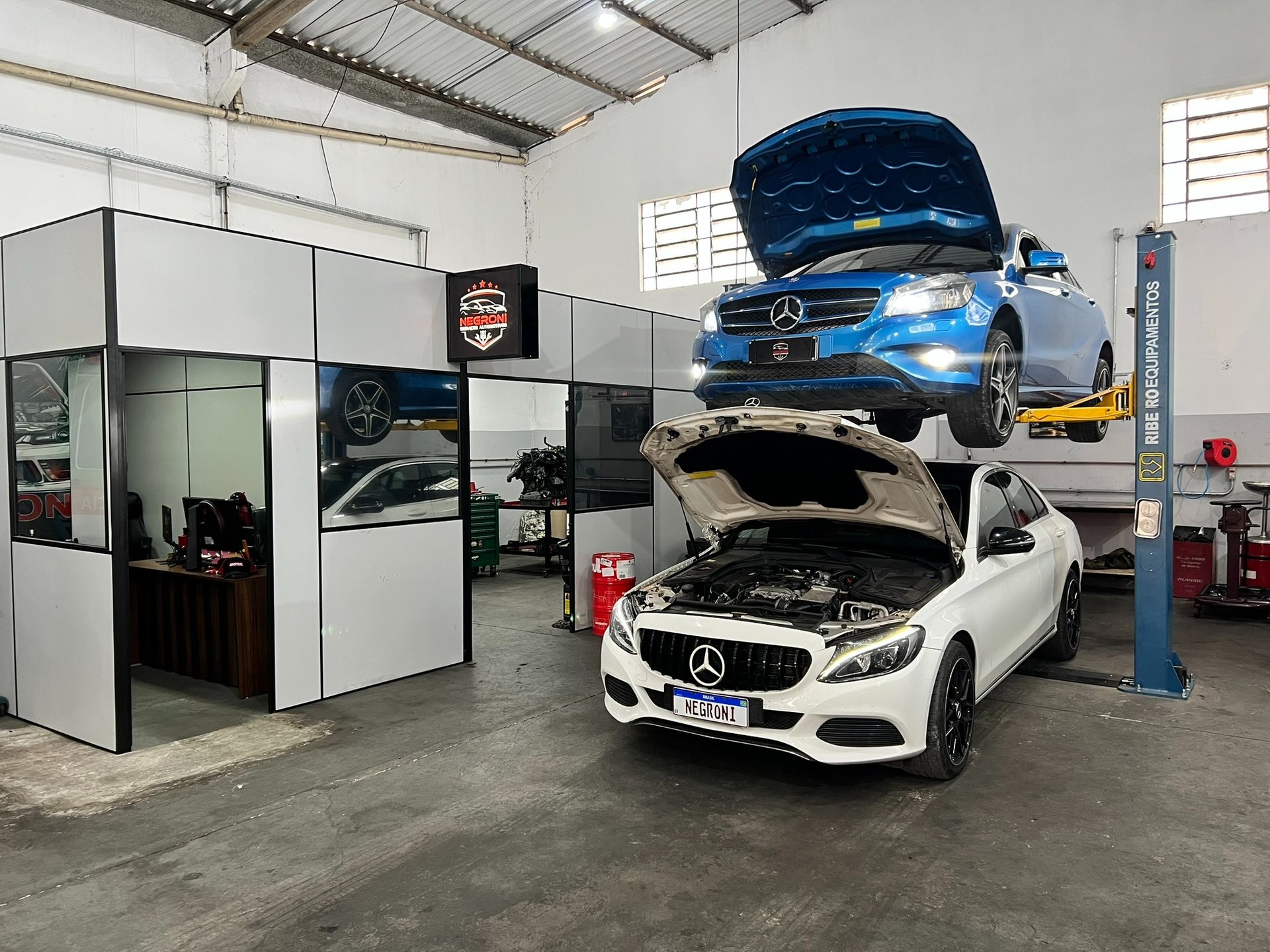 black and brown leather padded tub sofa