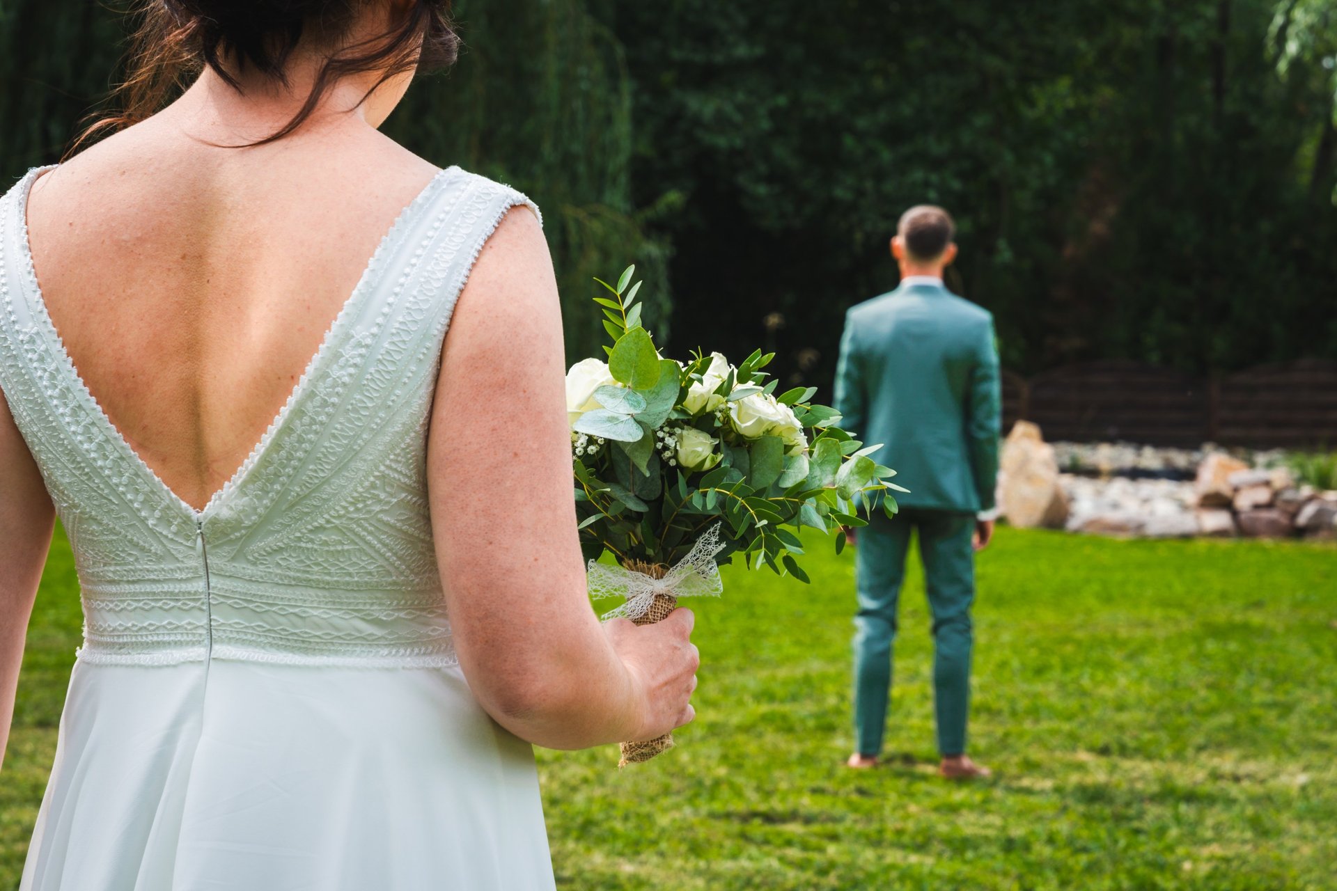 woman wearing yellow long-sleeved dress under white clouds and blue sky during daytime