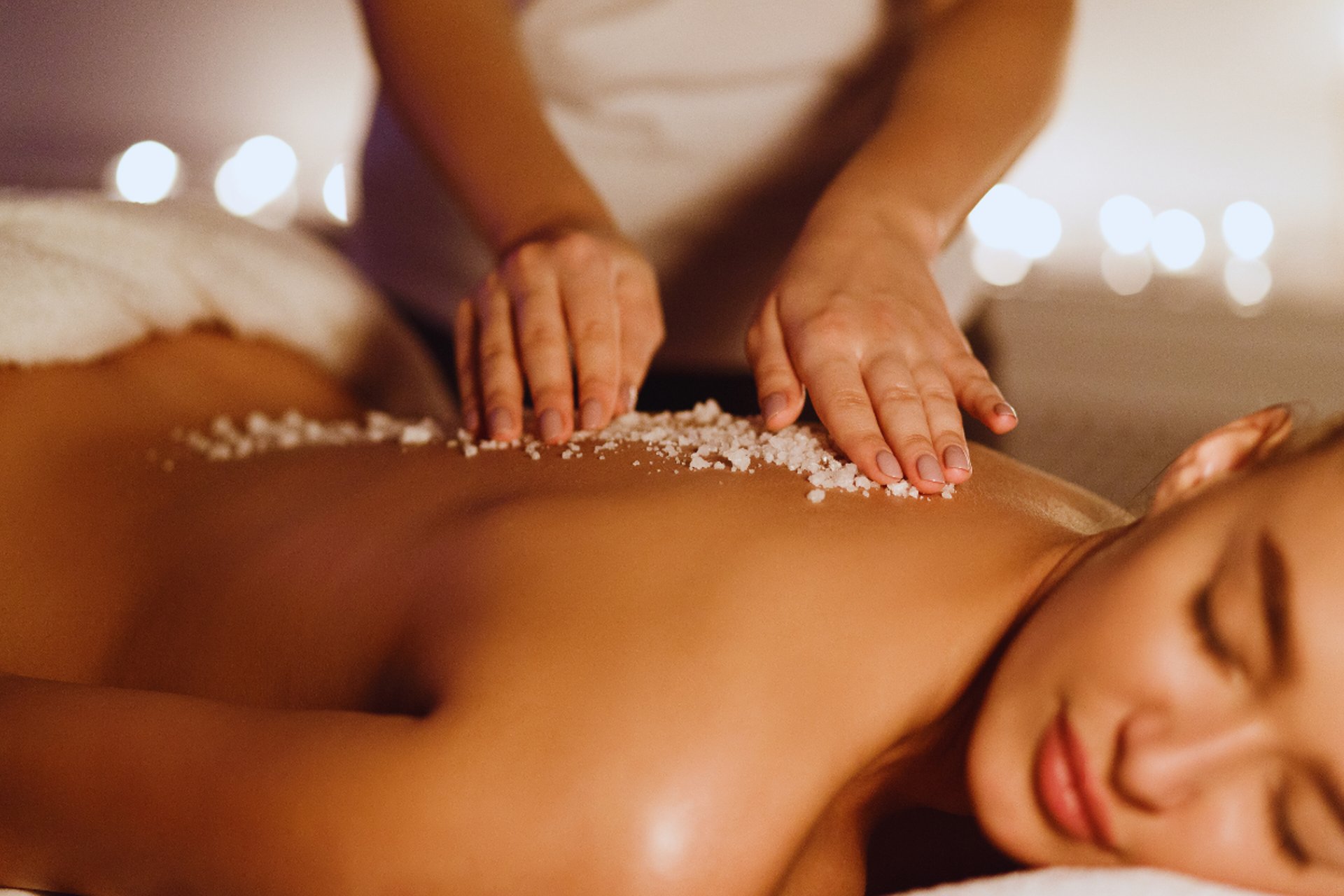 person lying down on white surface