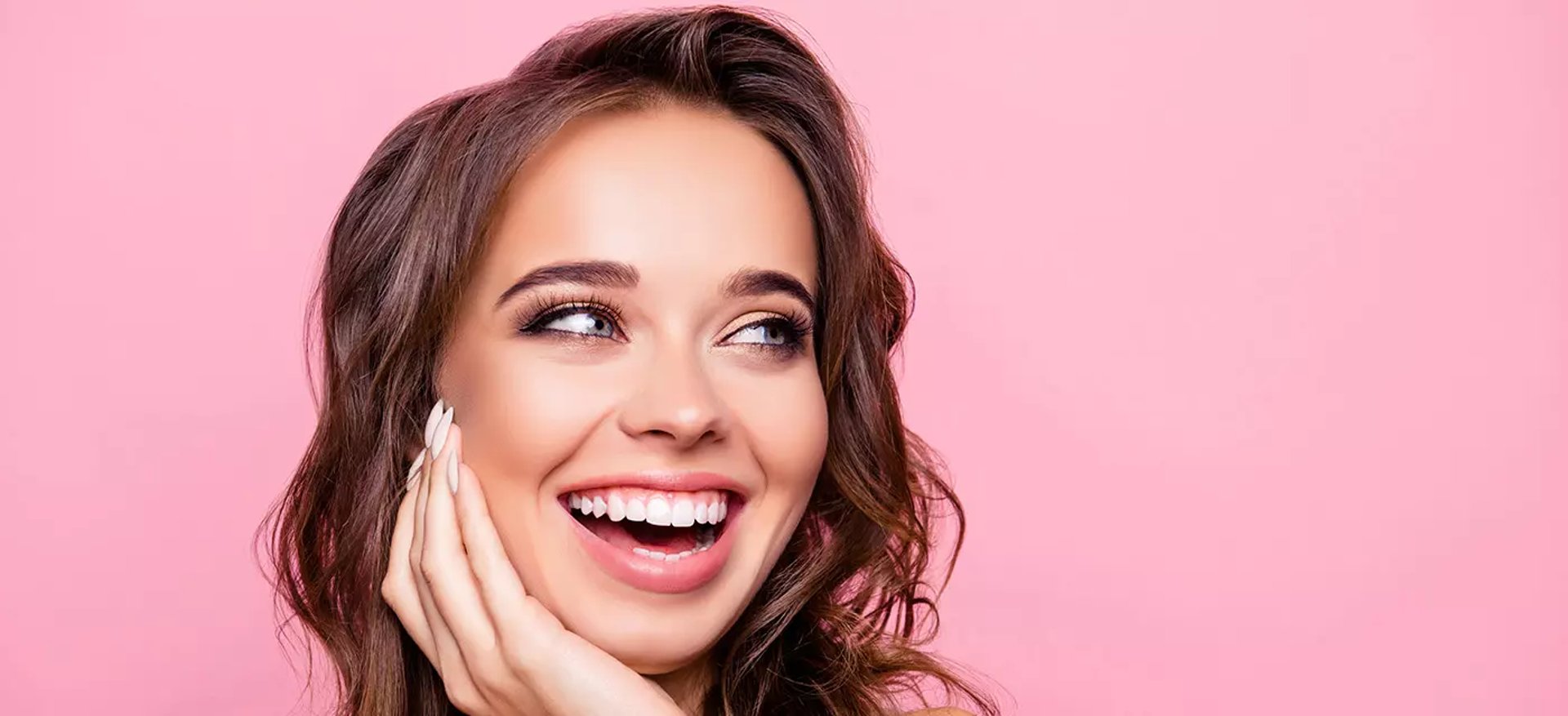 an abstract photo of a curved building with a blue sky in the background