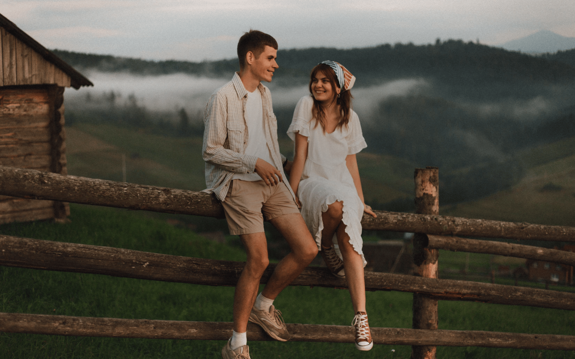 a man and a woman hug on the beach