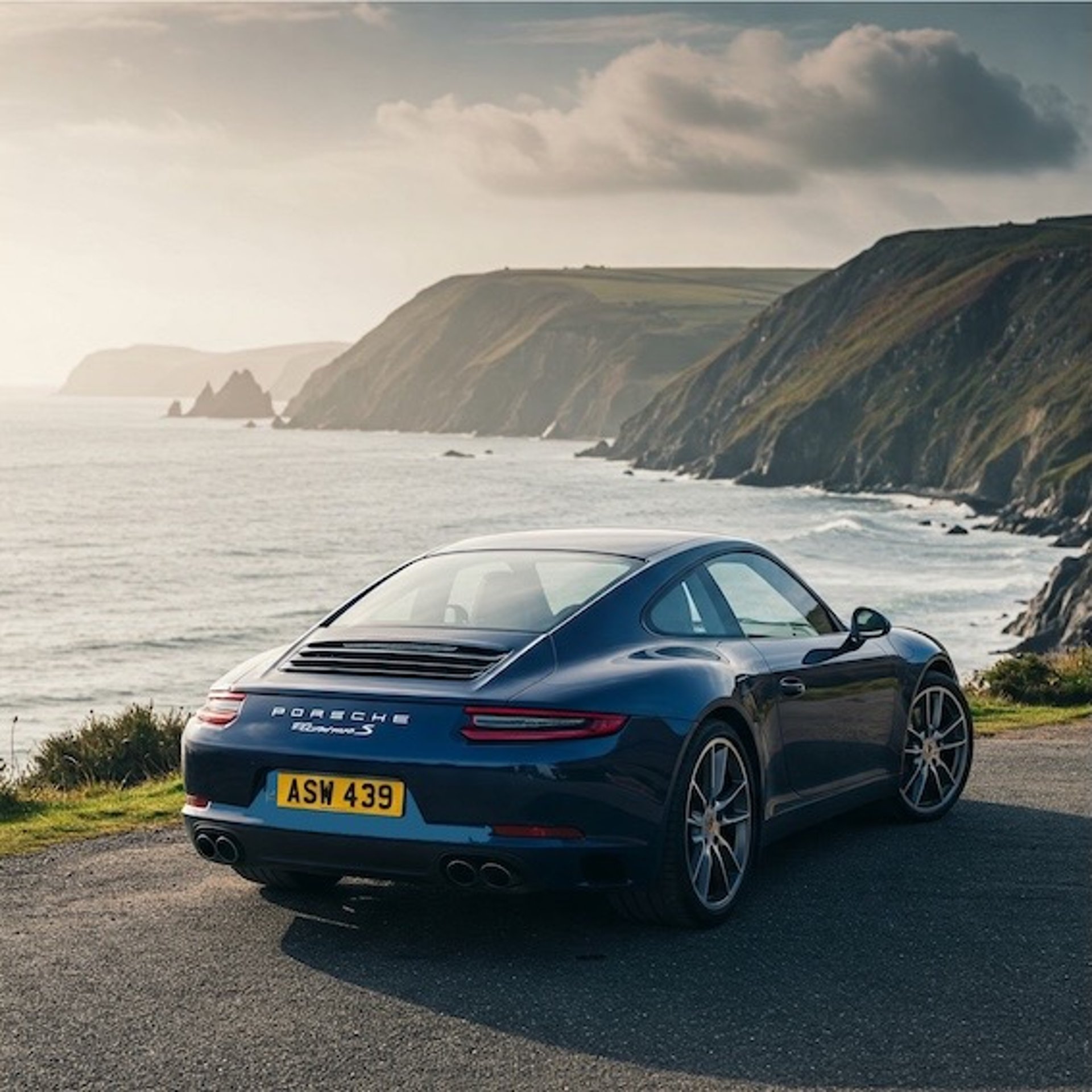 woman wearing yellow long-sleeved dress under white clouds and blue sky during daytime