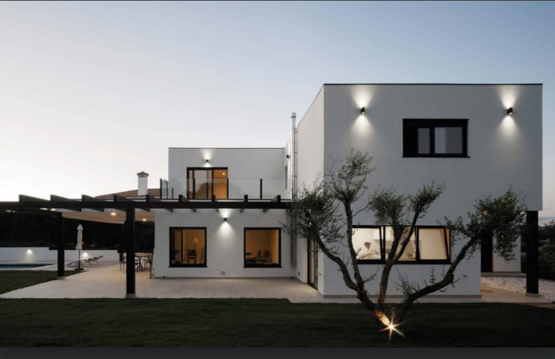 an abstract photo of a curved building with a blue sky in the background