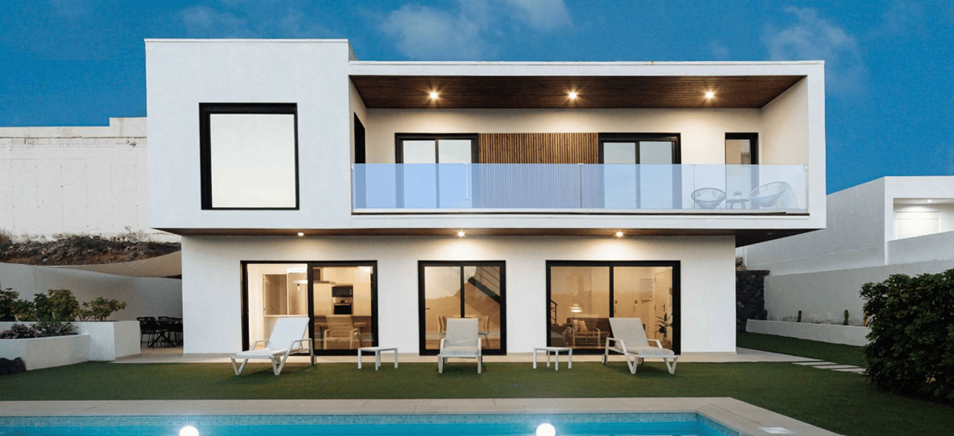 an abstract photo of a curved building with a blue sky in the background