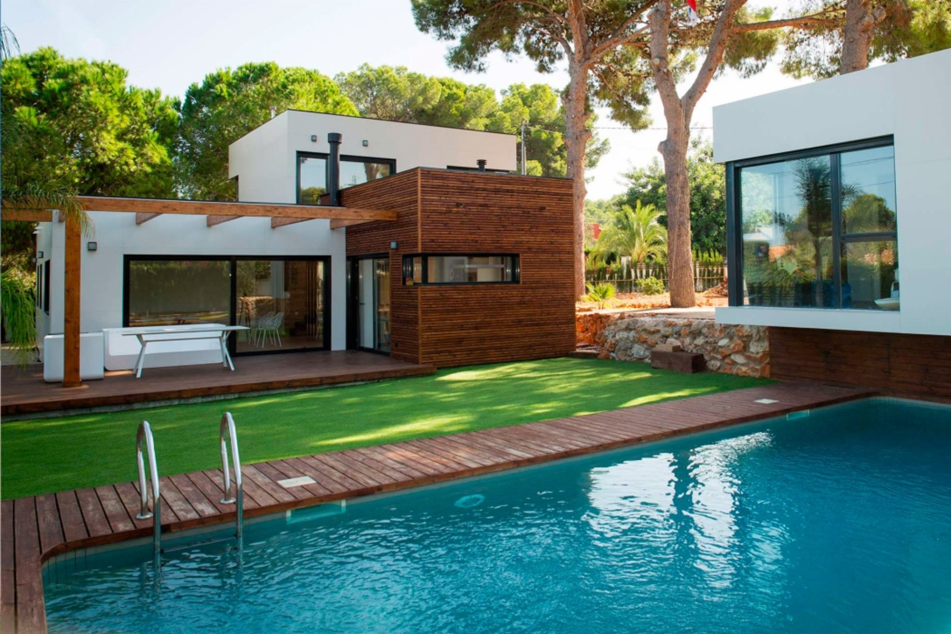 an abstract photo of a curved building with a blue sky in the background