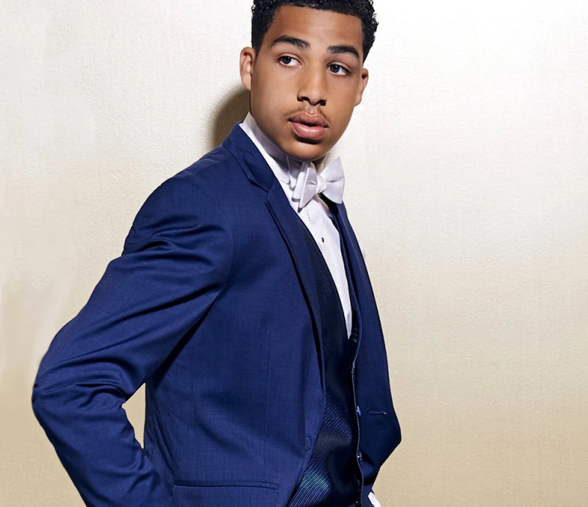 an abstract photo of a curved building with a blue sky in the background