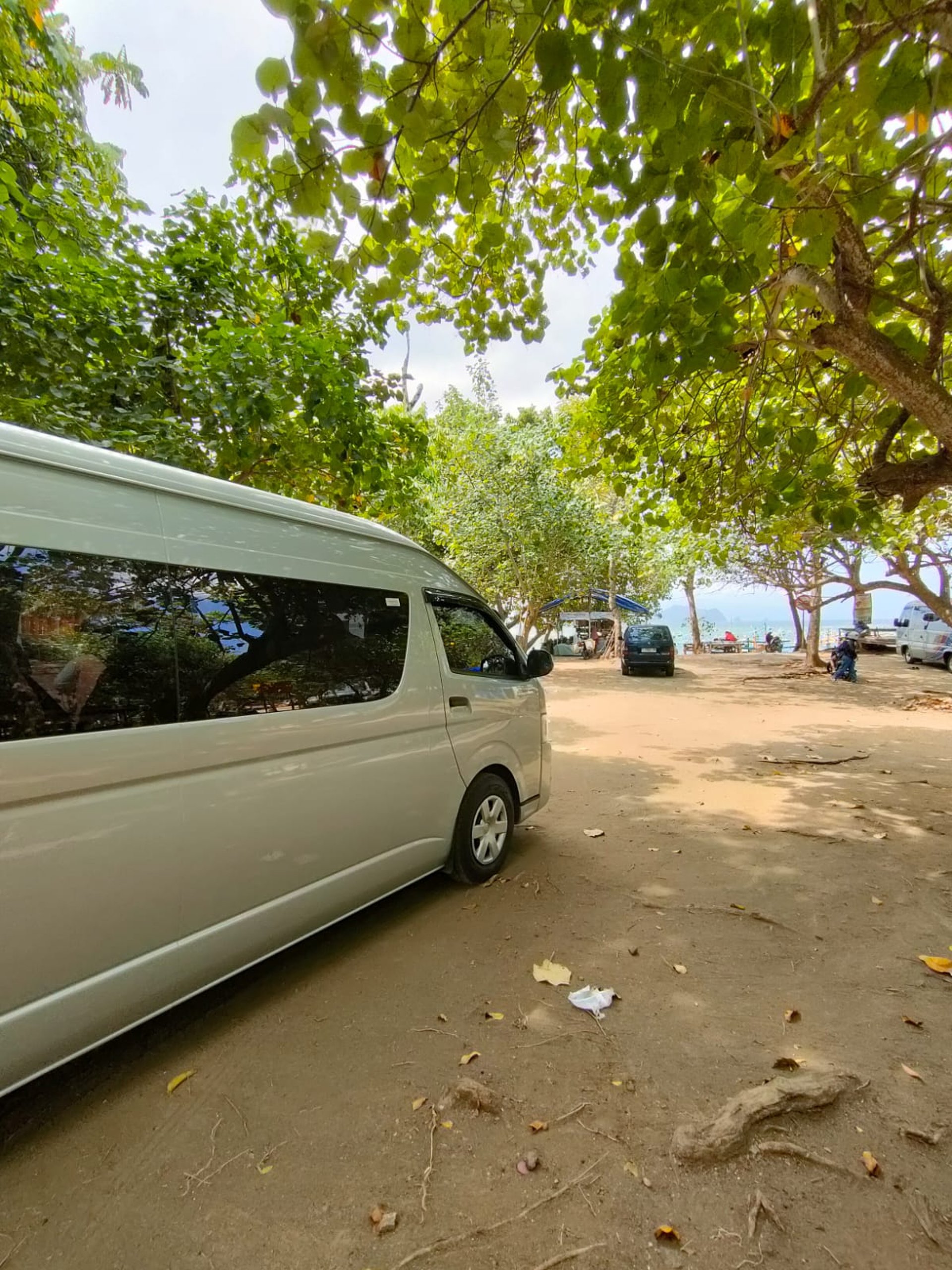 woman wearing yellow long-sleeved dress under white clouds and blue sky during daytime