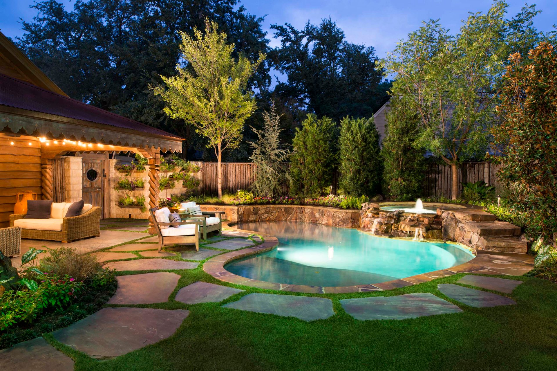a backyard with a pool and a house in the background
