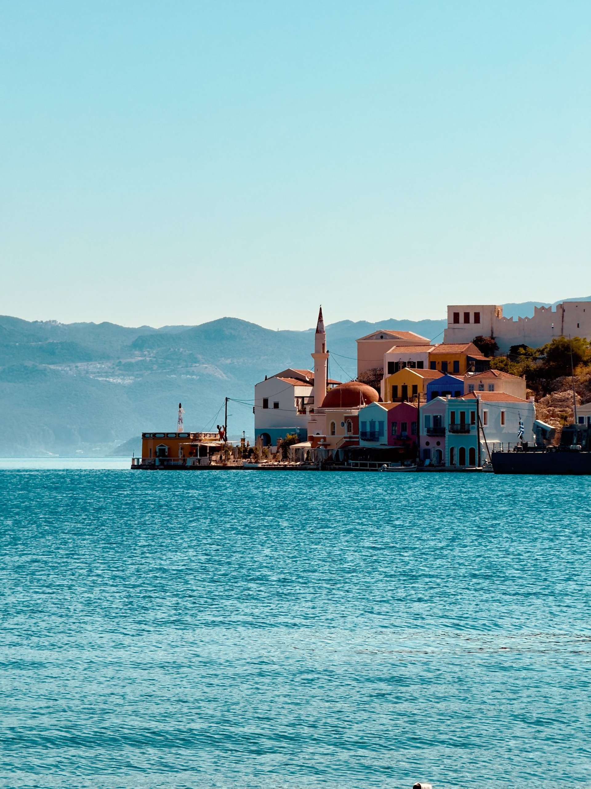 woman wearing yellow long-sleeved dress under white clouds and blue sky during daytime