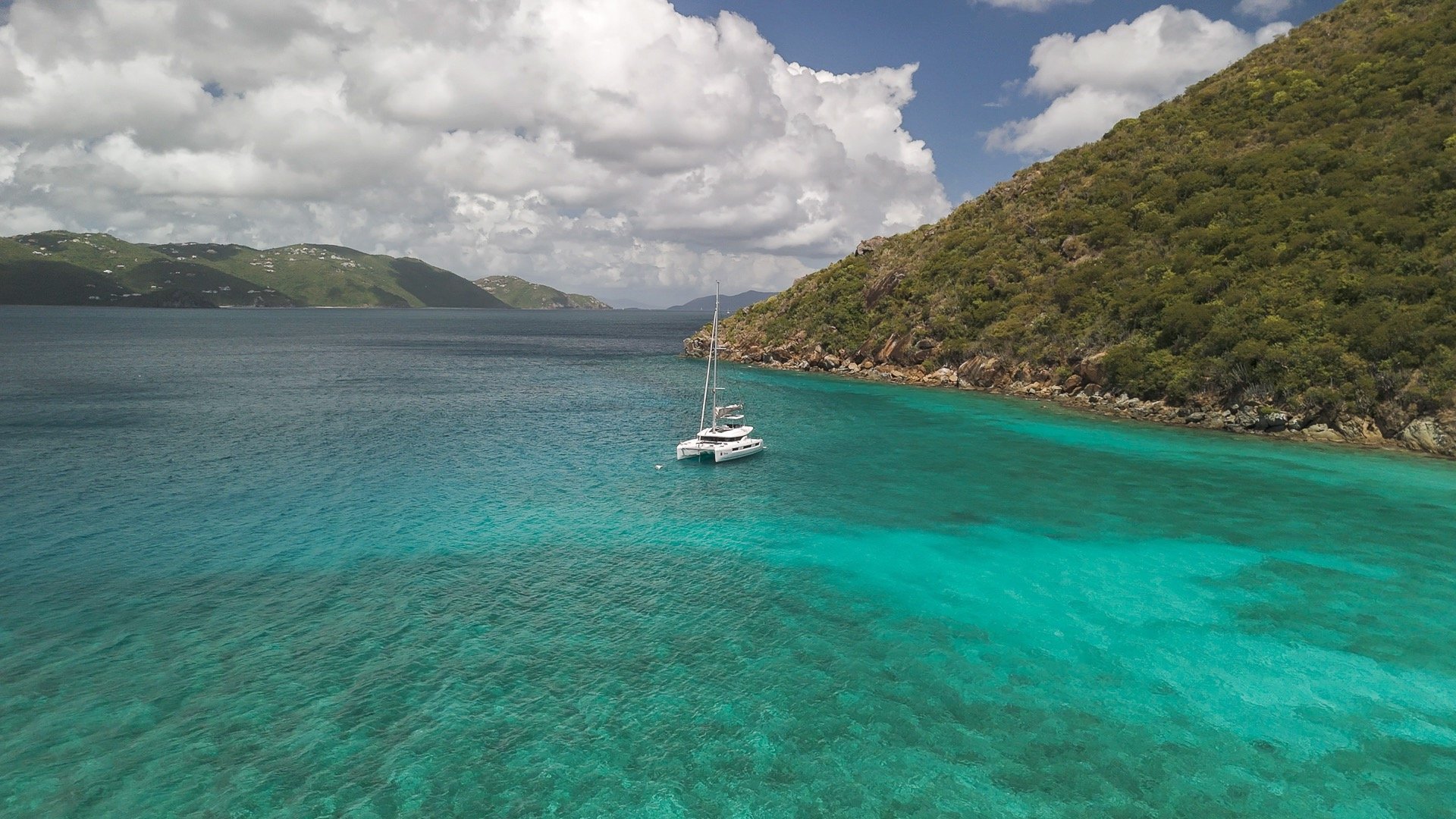 an abstract photo of a curved building with a blue sky in the background