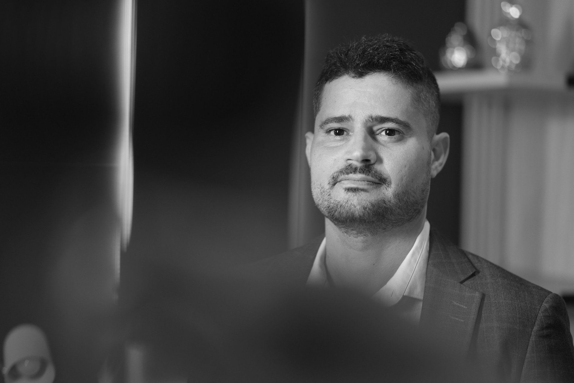 an abstract photo of a curved building with a blue sky in the background