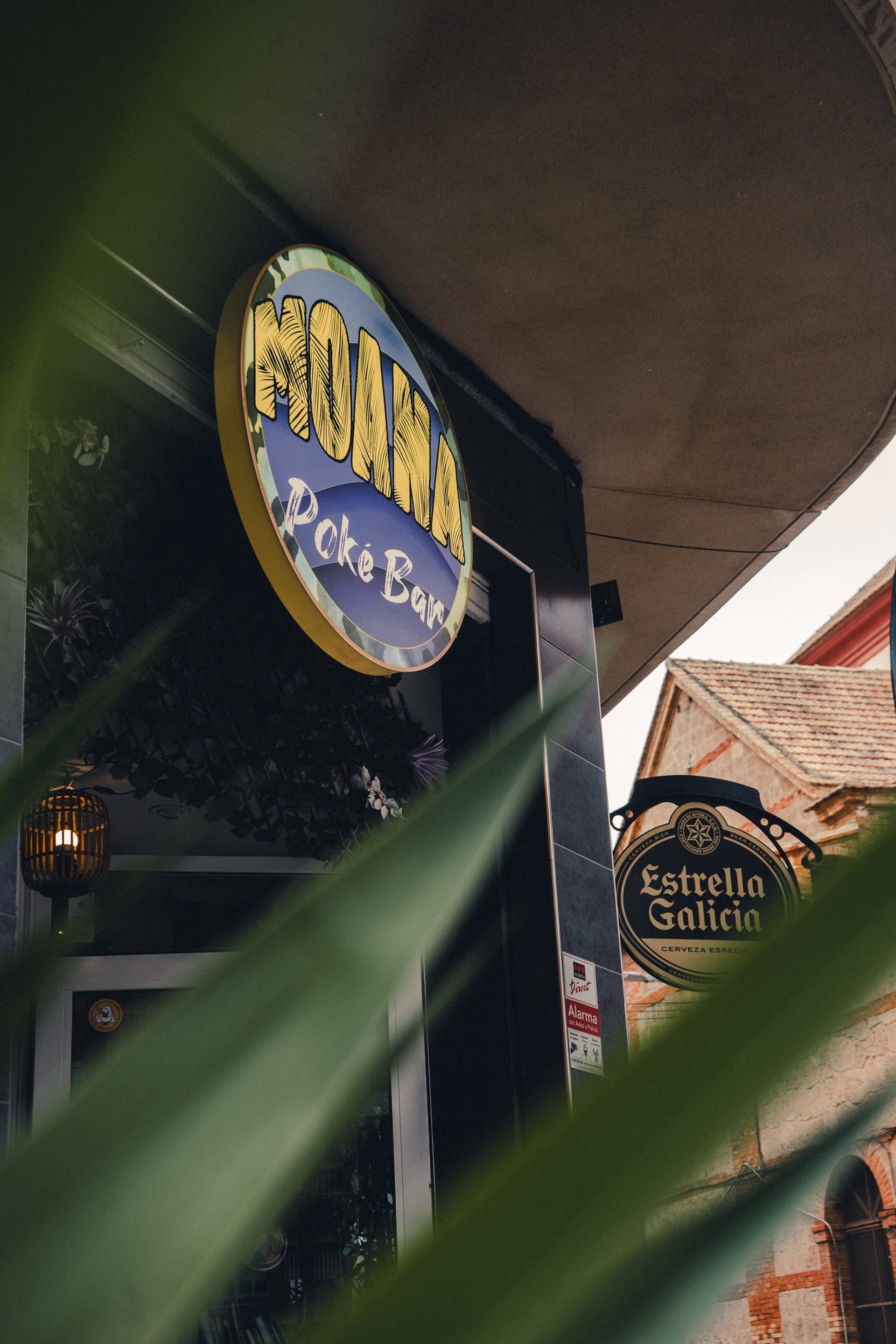 an abstract photo of a curved building with a blue sky in the background