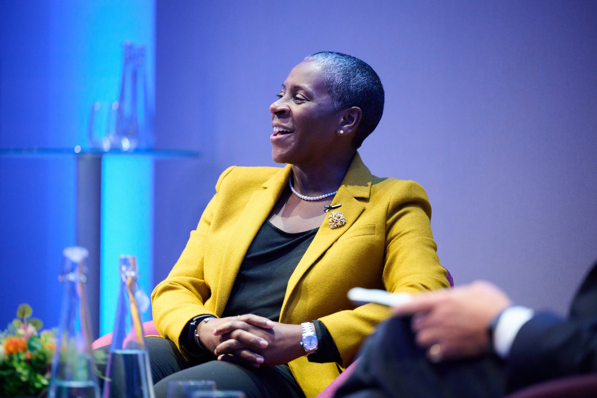 woman wearing yellow long-sleeved dress under white clouds and blue sky during daytime