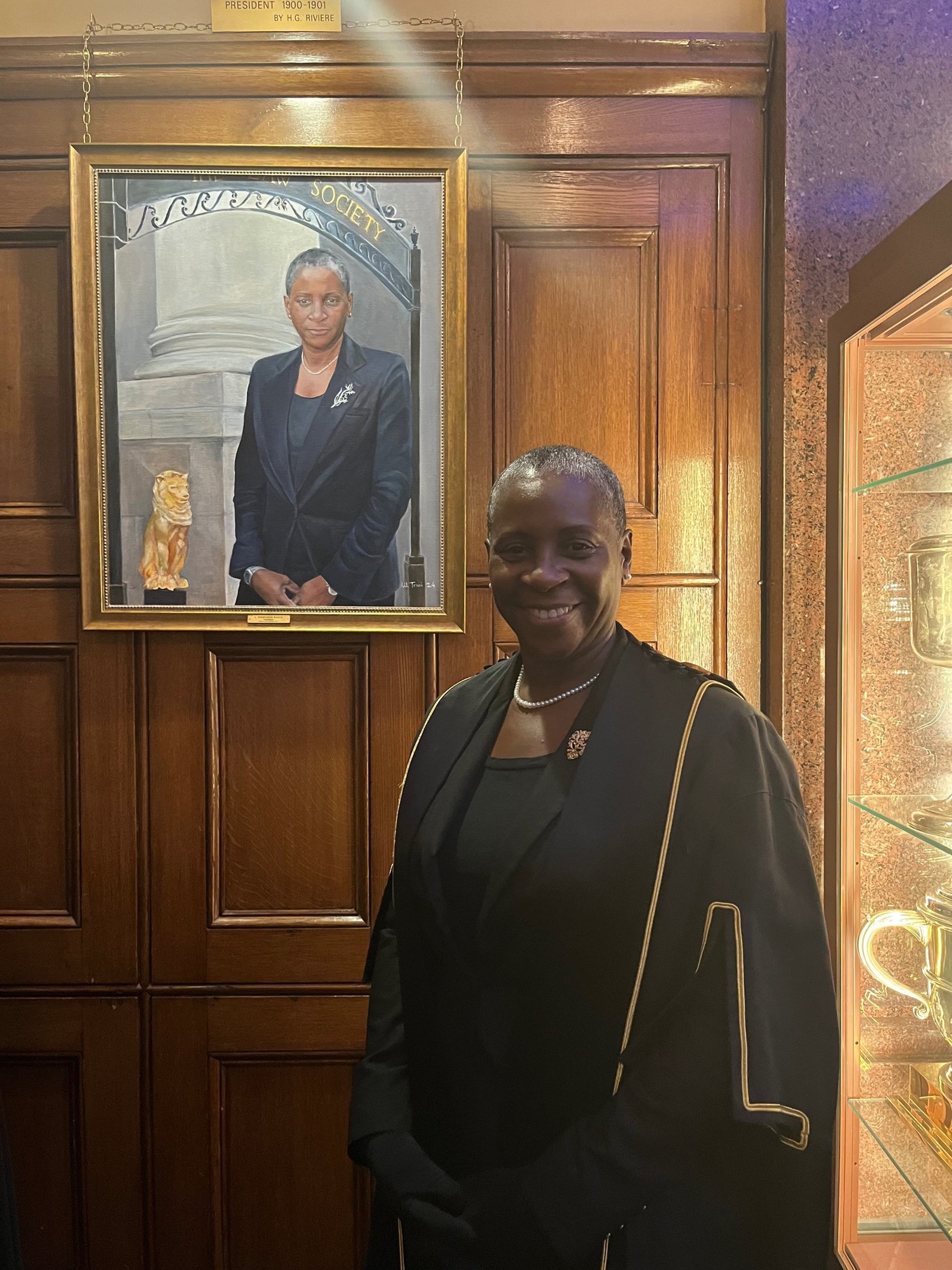 an abstract photo of a curved building with a blue sky in the background