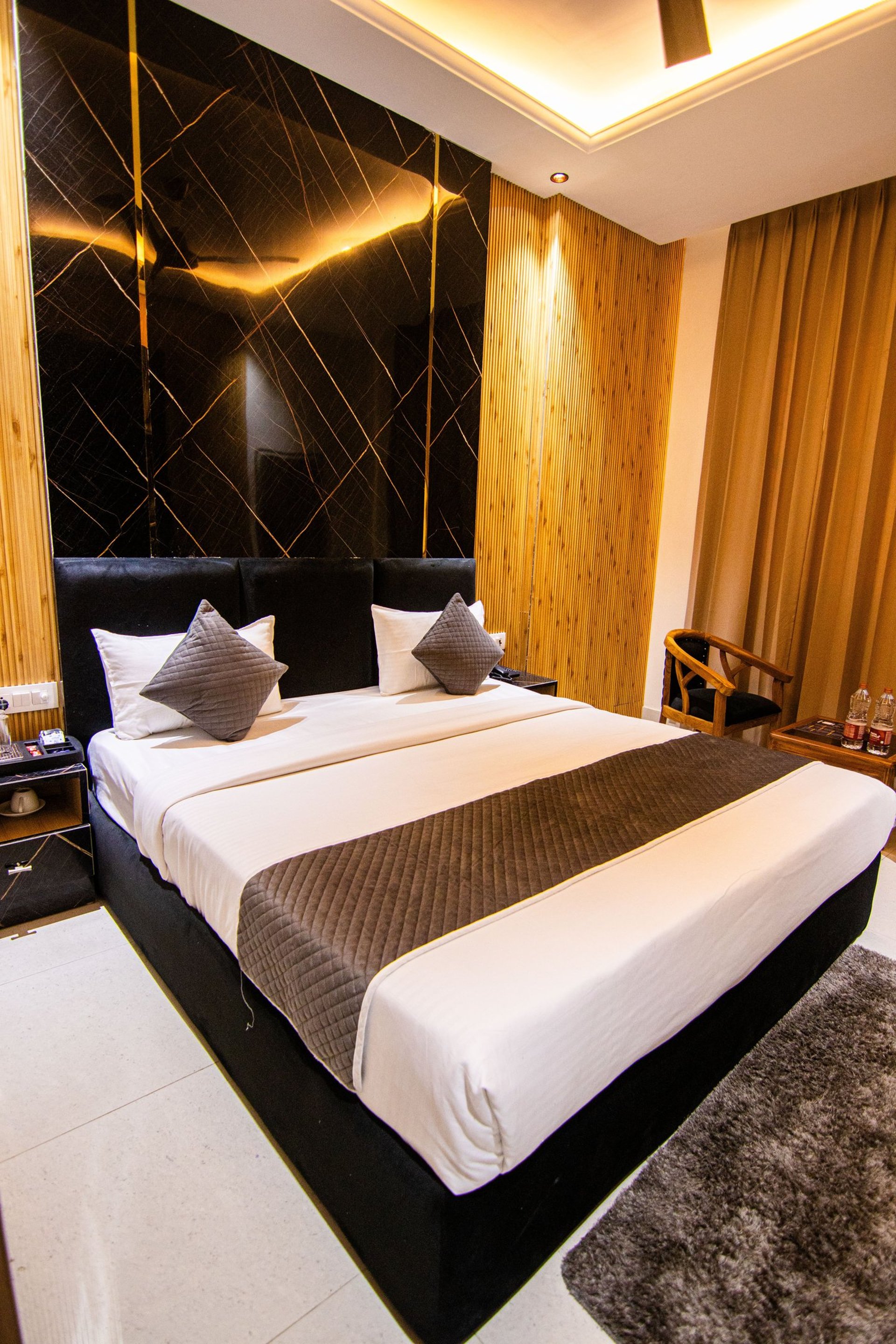 white bed linen with throw pillows