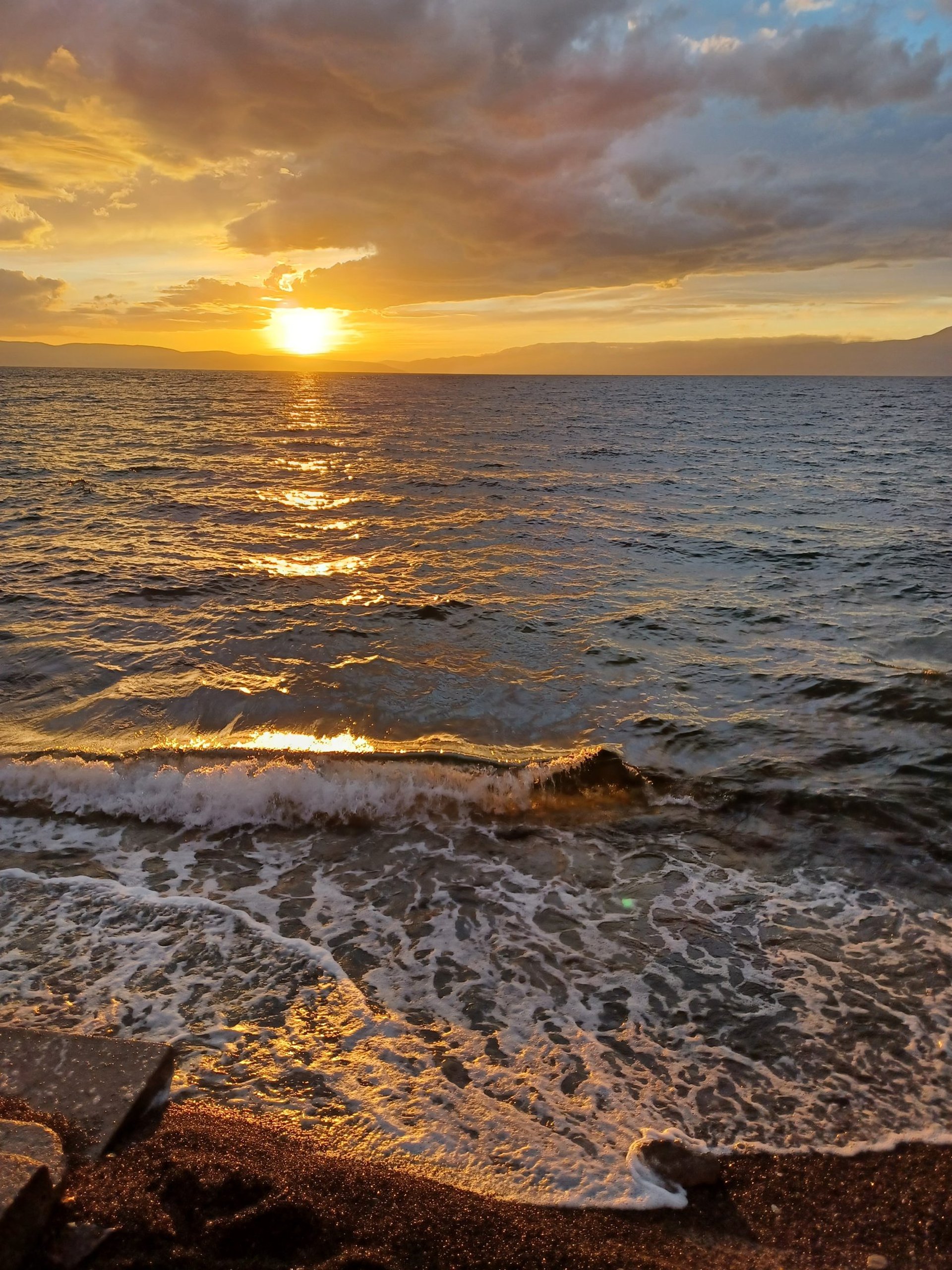 woman wearing yellow long-sleeved dress under white clouds and blue sky during daytime