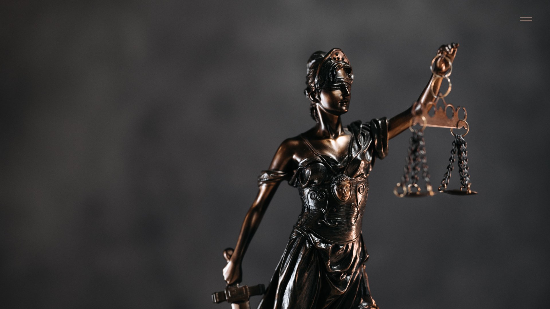 an abstract photo of a curved building with a blue sky in the background