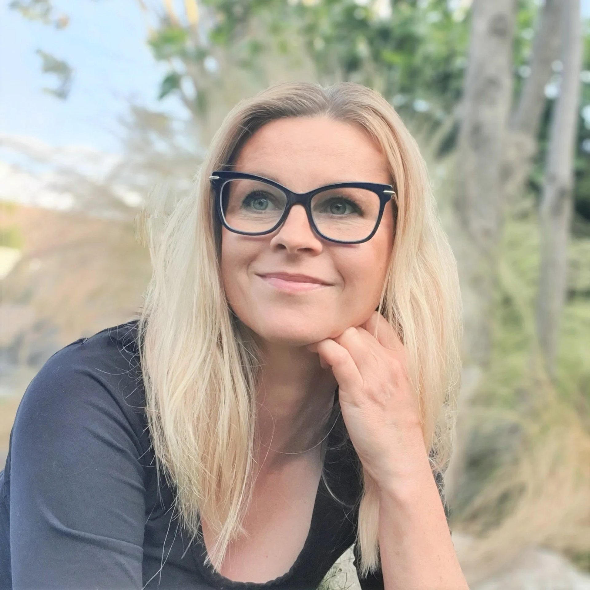 woman in white tank top and blue denim jeans jumping on brown wooden platform