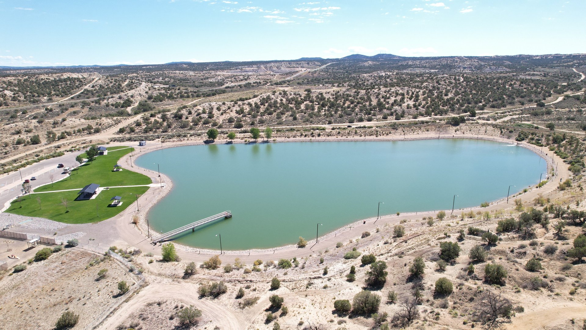 woman wearing yellow long-sleeved dress under white clouds and blue sky during daytime