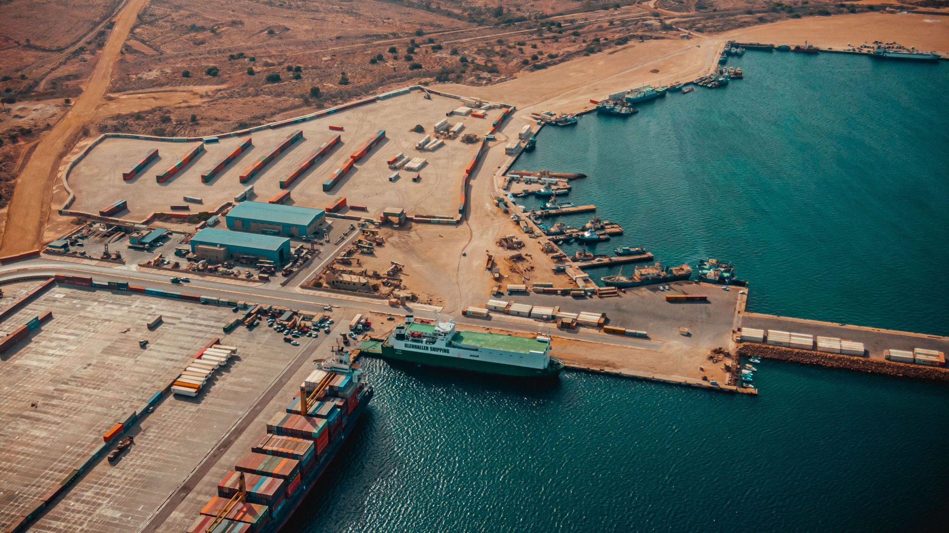 an abstract photo of a curved building with a blue sky in the background