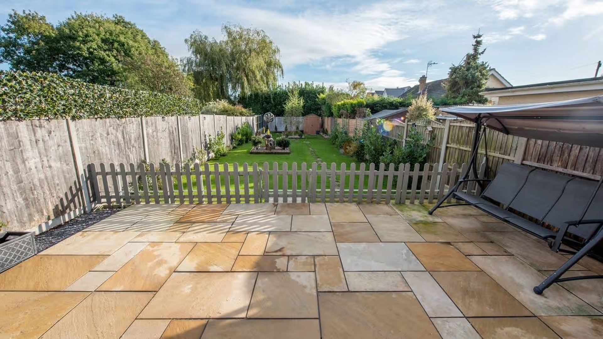 woman wearing yellow long-sleeved dress under white clouds and blue sky during daytime