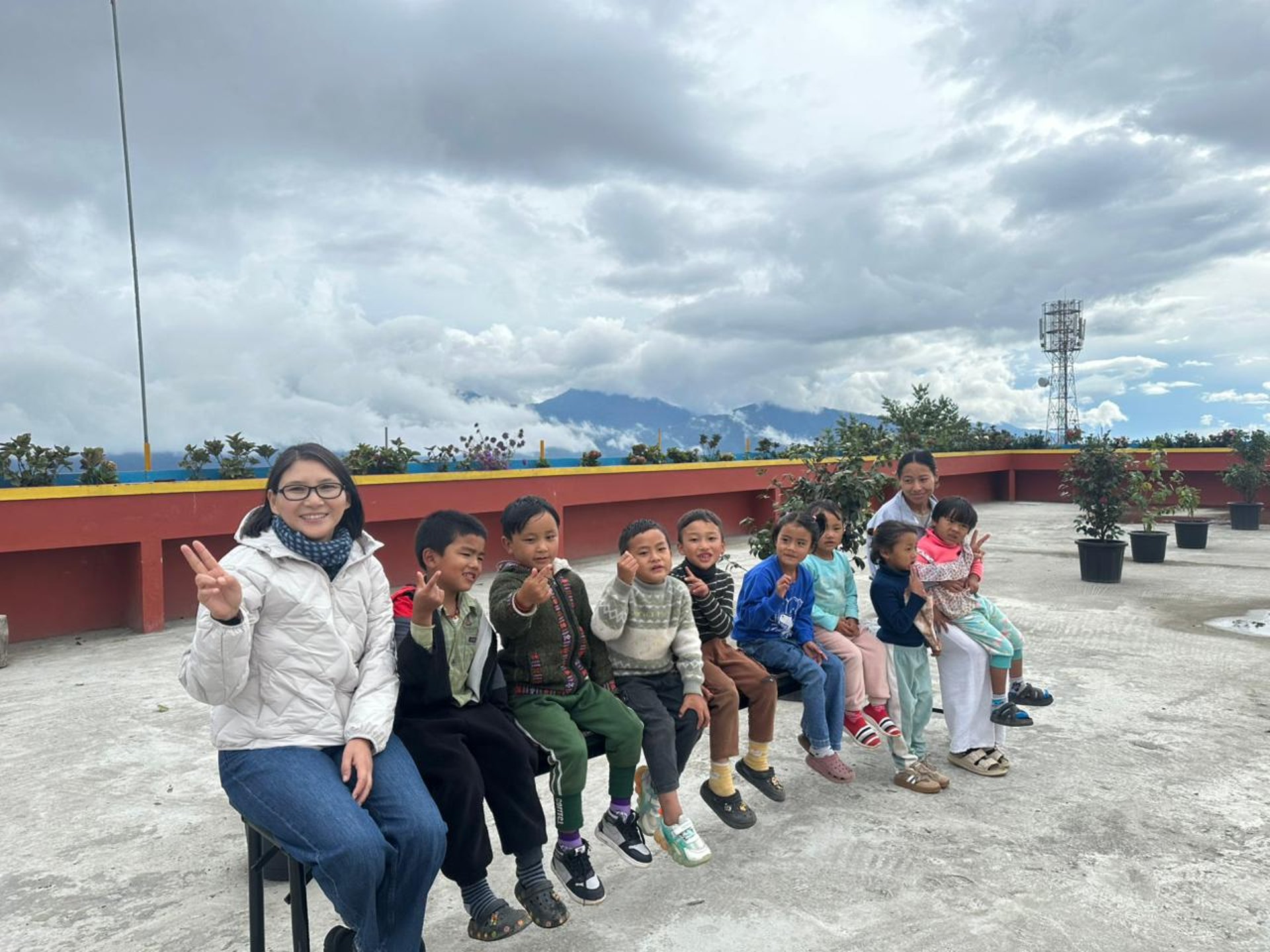 woman wearing yellow long-sleeved dress under white clouds and blue sky during daytime