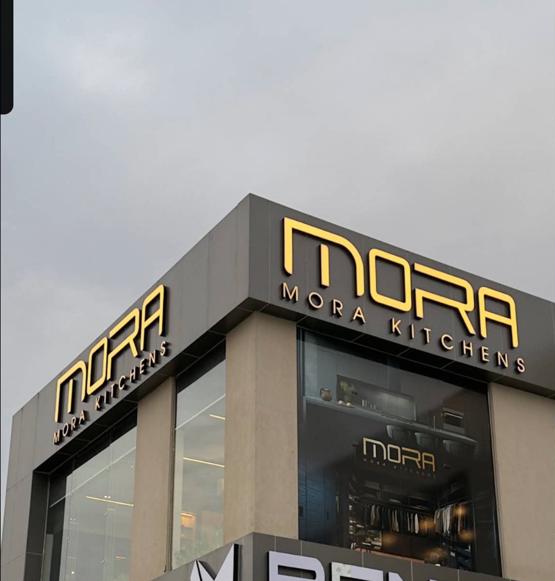 an abstract photo of a curved building with a blue sky in the background