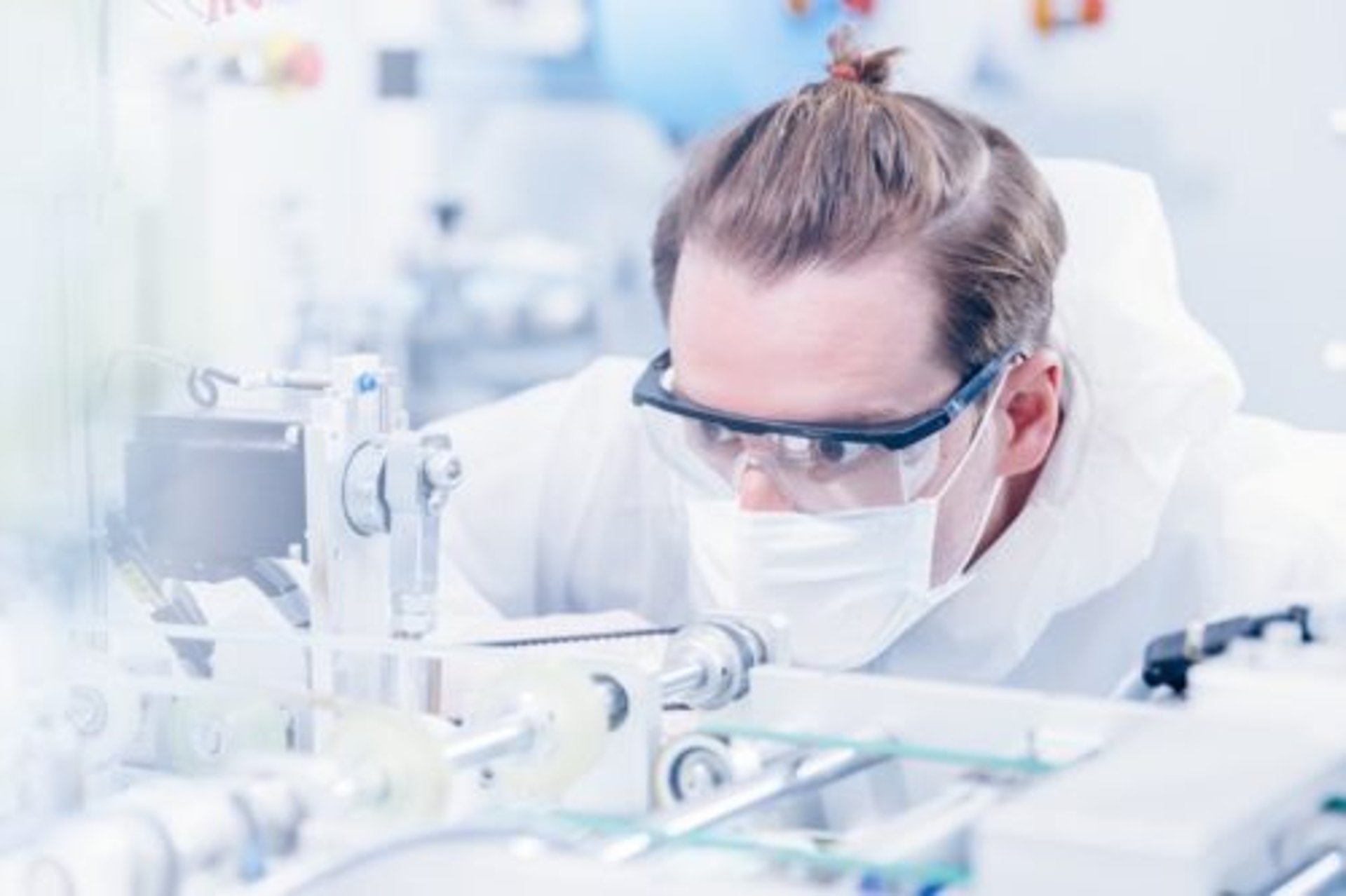 an abstract photo of a curved building with a blue sky in the background