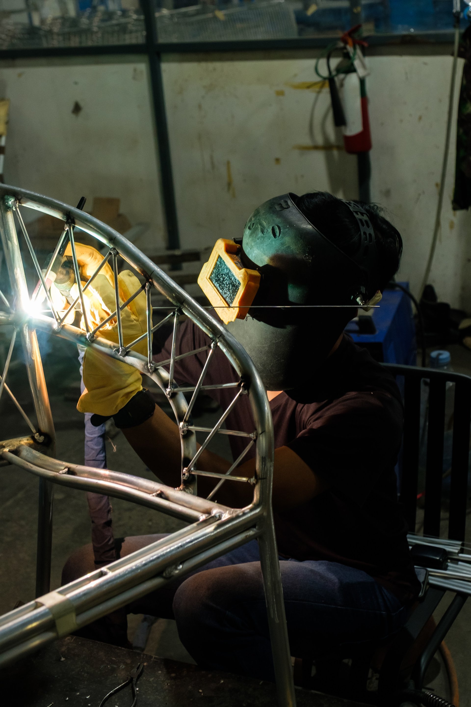 an abstract photo of a curved building with a blue sky in the background