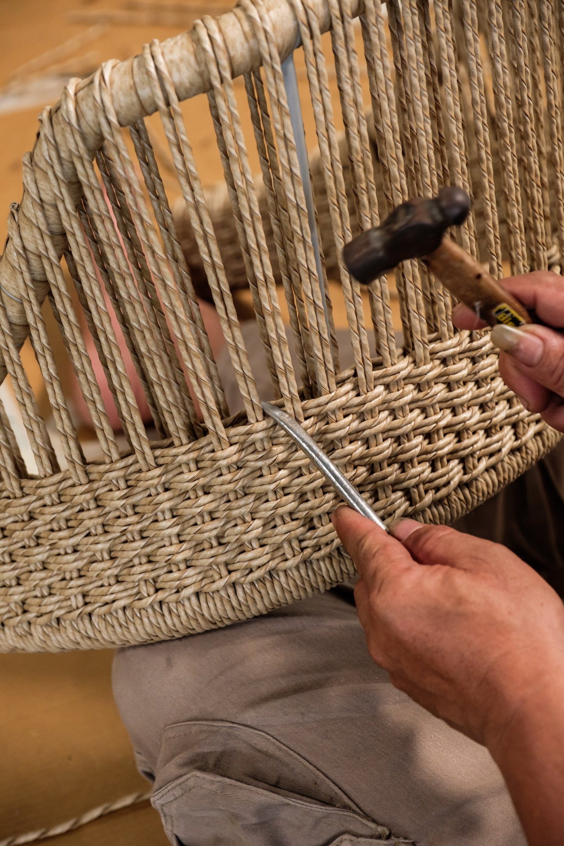 an abstract photo of a curved building with a blue sky in the background
