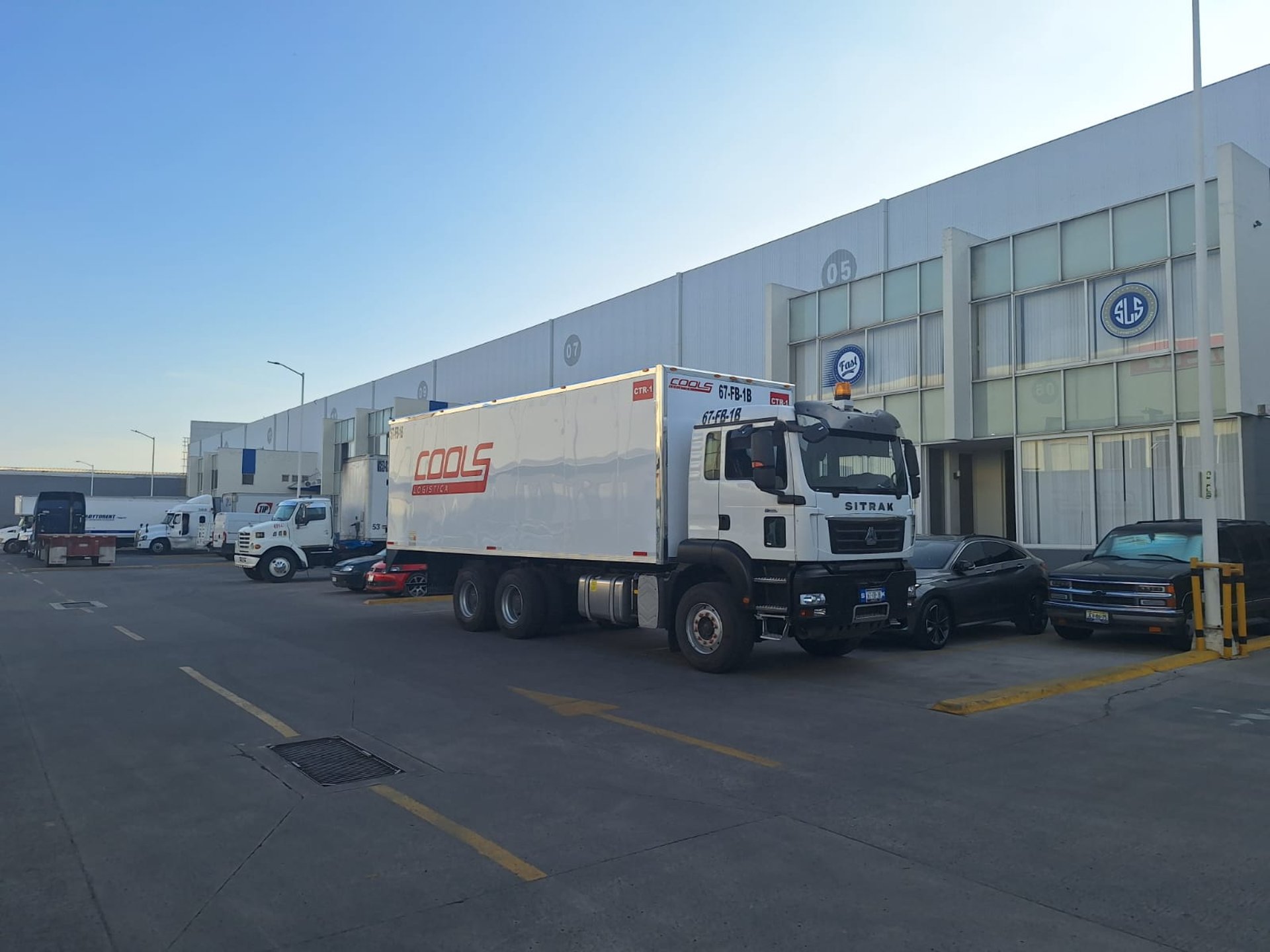 woman wearing yellow long-sleeved dress under white clouds and blue sky during daytime