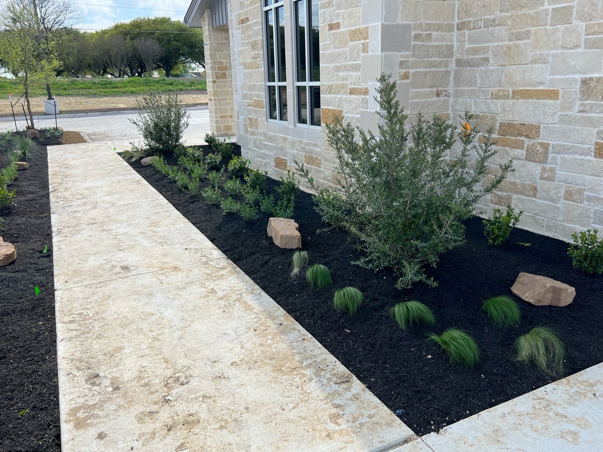 white and brown concrete building near green grass field during daytime