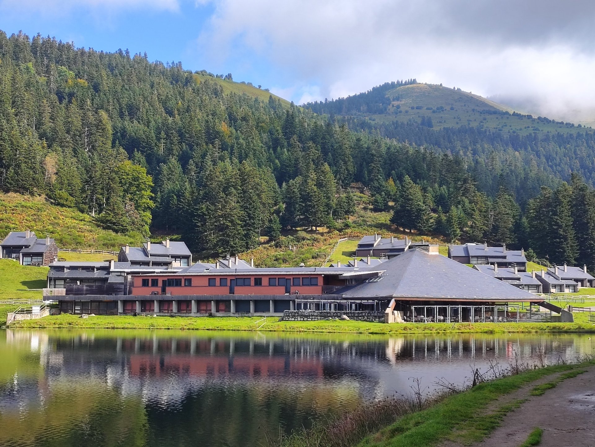 woman wearing yellow long-sleeved dress under white clouds and blue sky during daytime