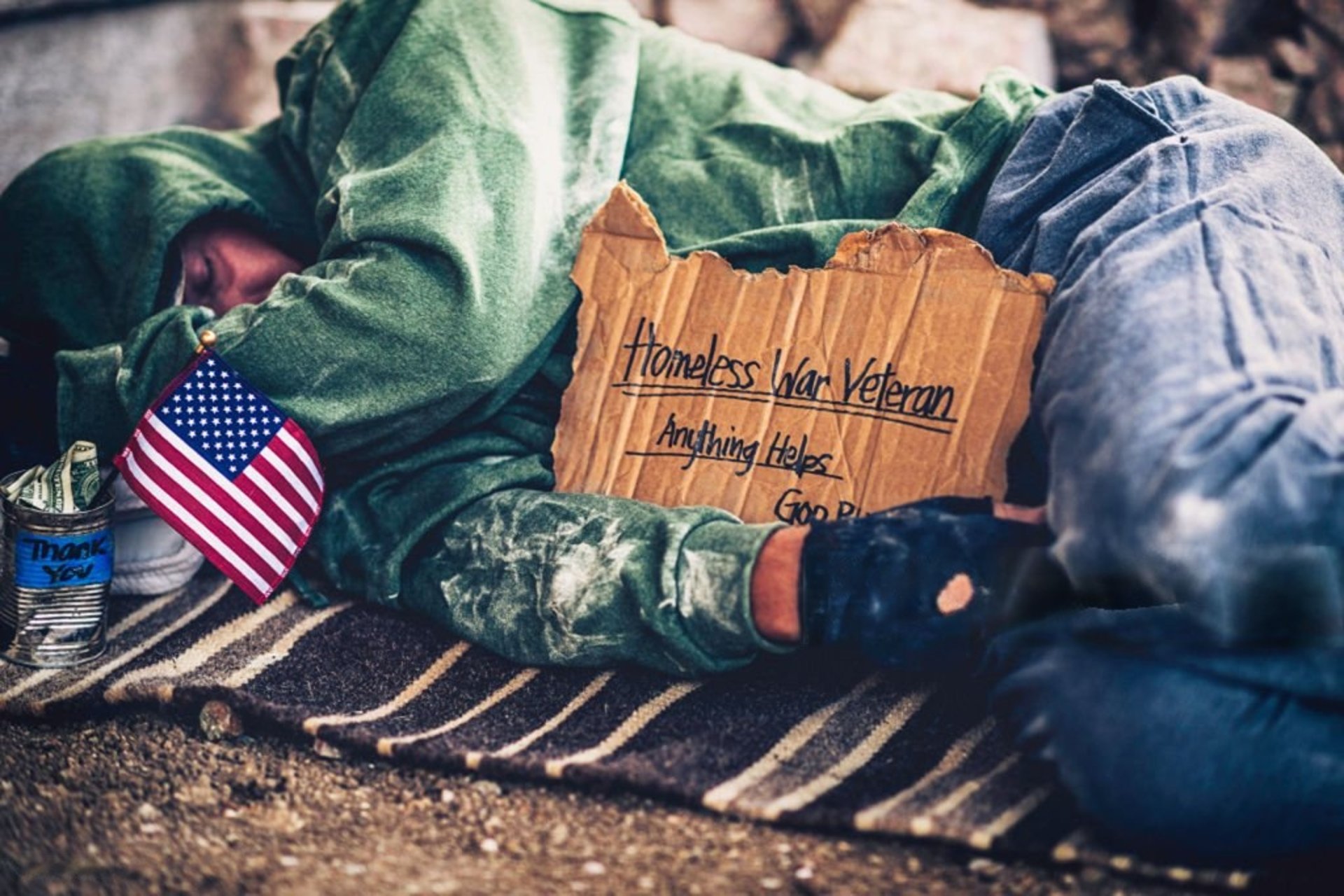 man in black jacket sitting on black wheelchair