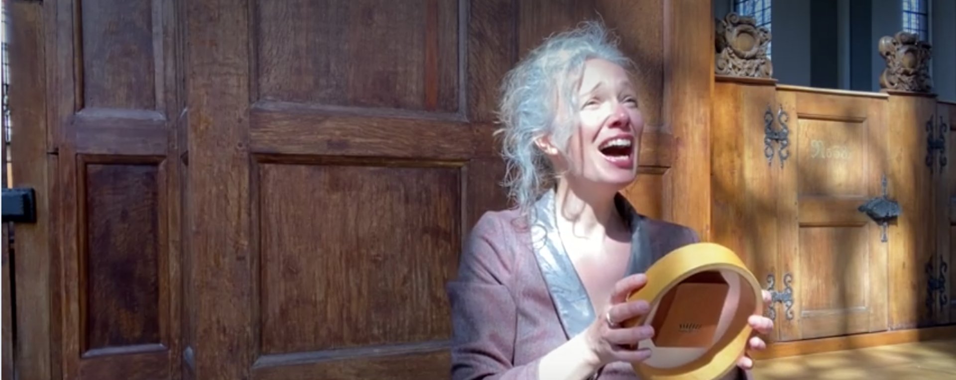 woman wearing yellow long-sleeved dress under white clouds and blue sky during daytime