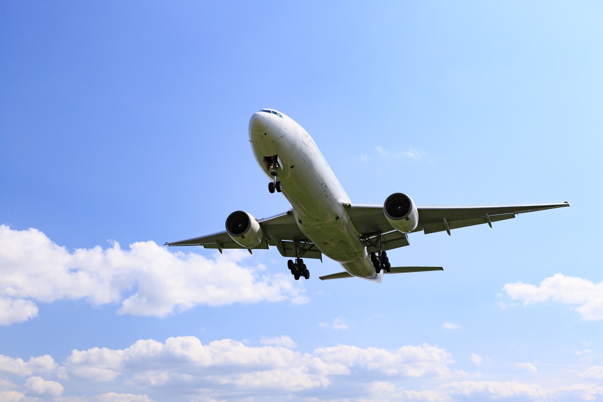 white airplane on mid air