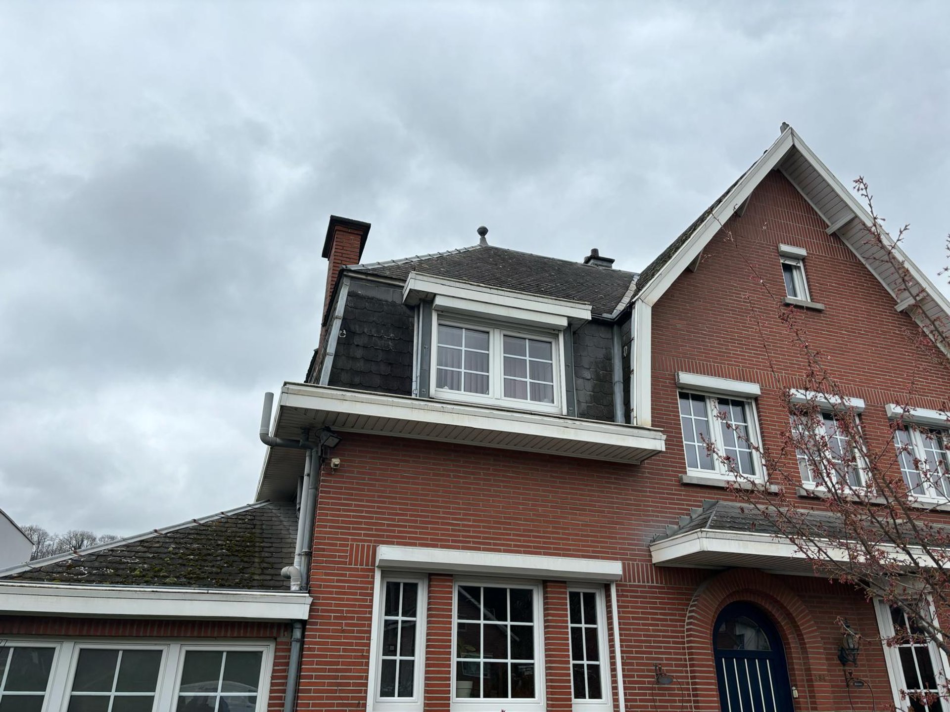 an abstract photo of a curved building with a blue sky in the background