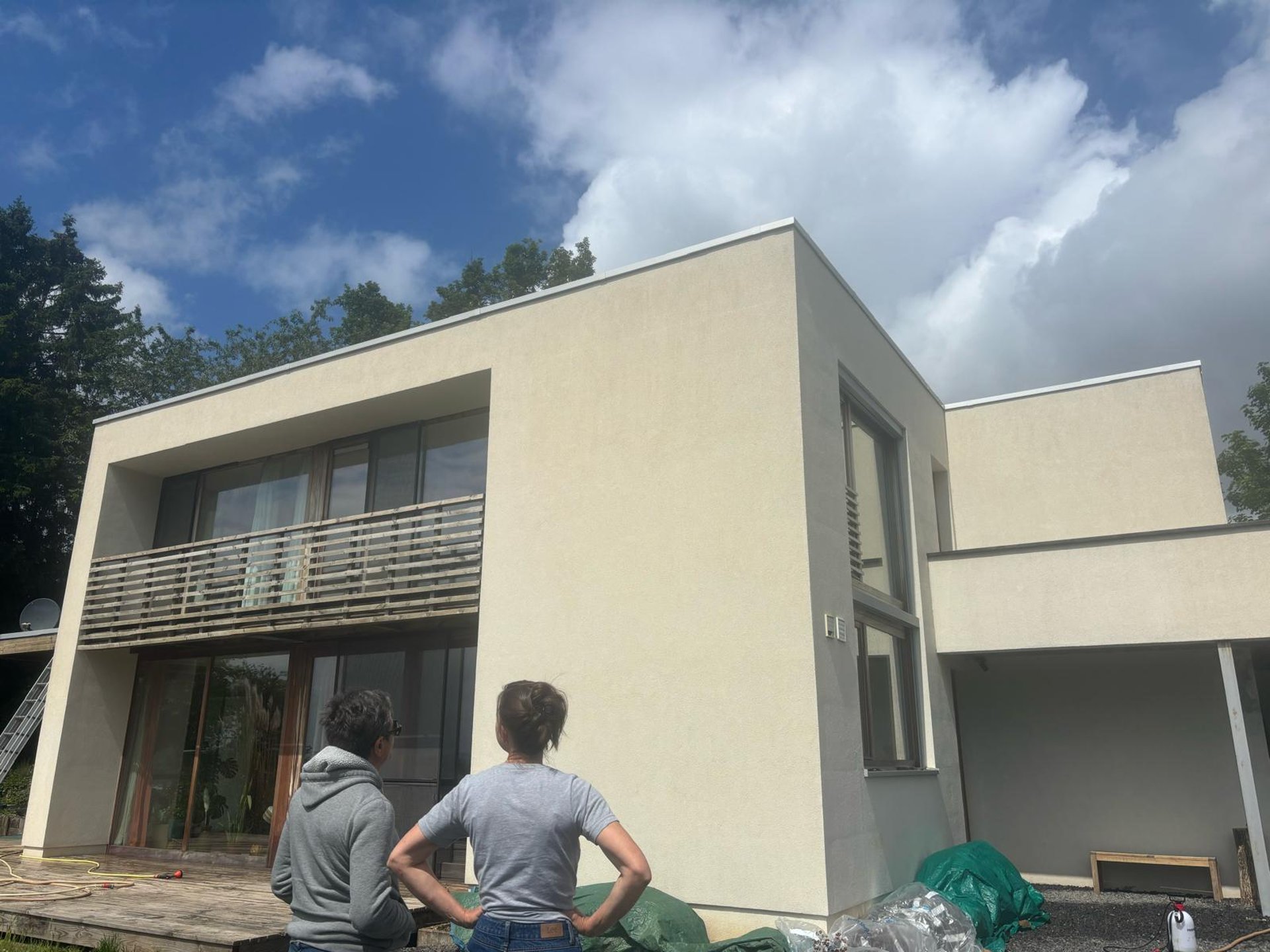 an abstract photo of a curved building with a blue sky in the background